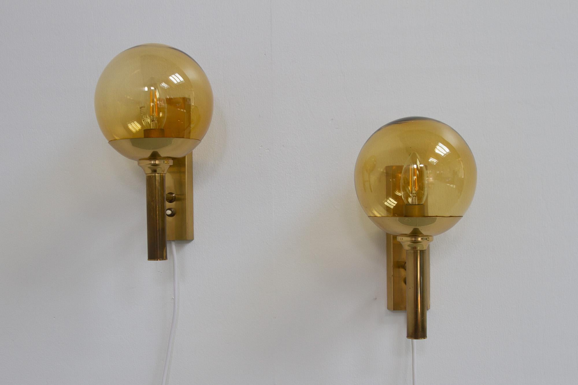 Vintage Brass Sconces by Sv. Mejlstrøm for Mejlstrøm Belysning, 1960s. Set of 2.
Brass wall lamp with hand blown shade in smoked glass designed by Svend Mejlstrøm for Mejlstrøm Belysning. Svend Mejlstrøm is from the same school and period as