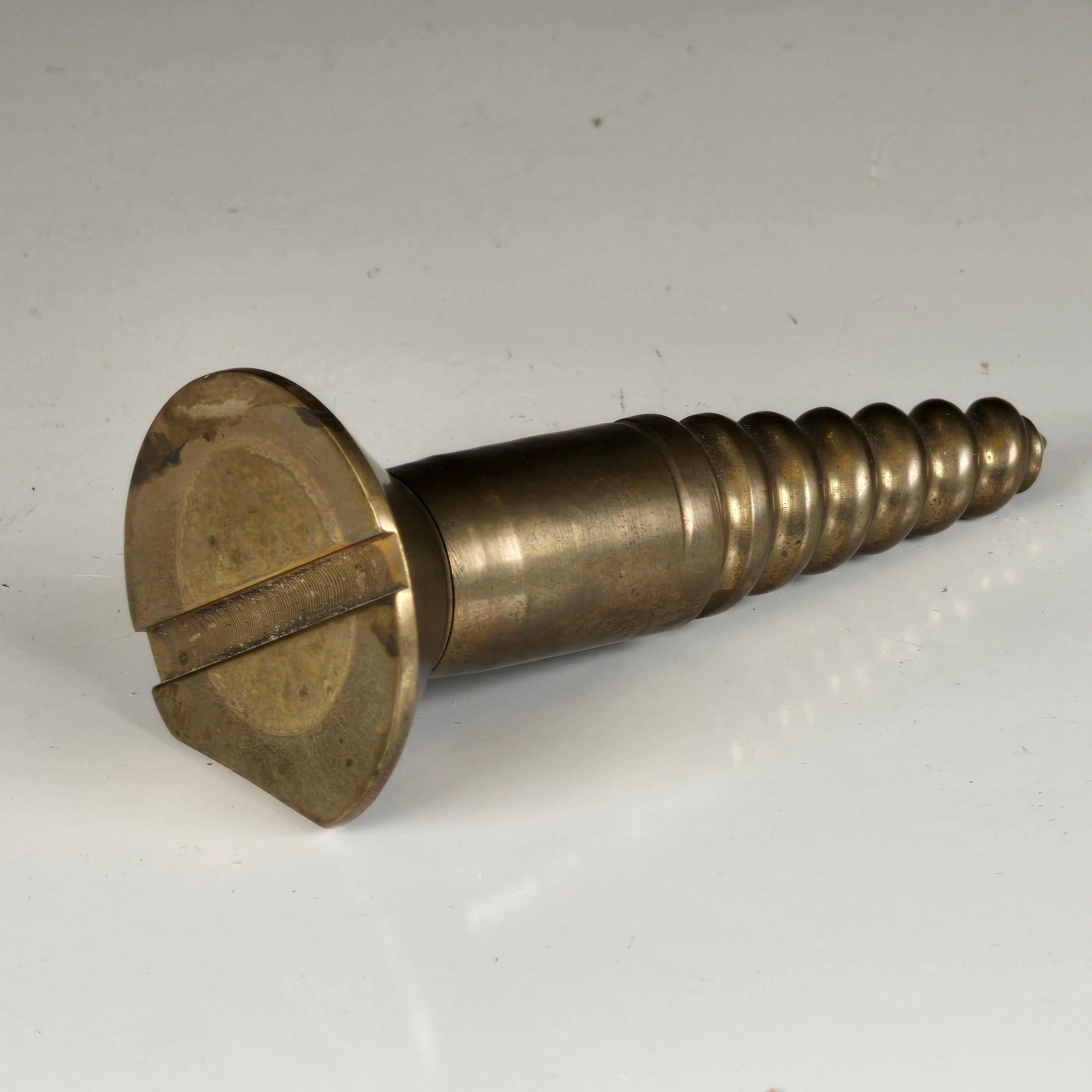 A stylish cast brass paperweight shaped like an oversized screw.  A humorous yet whimsical piece of design from the 1960s.  Great for anyone but would be fitting for an Architect or an Engineer.   Paperweight has a flat spot to keep it from rolling.