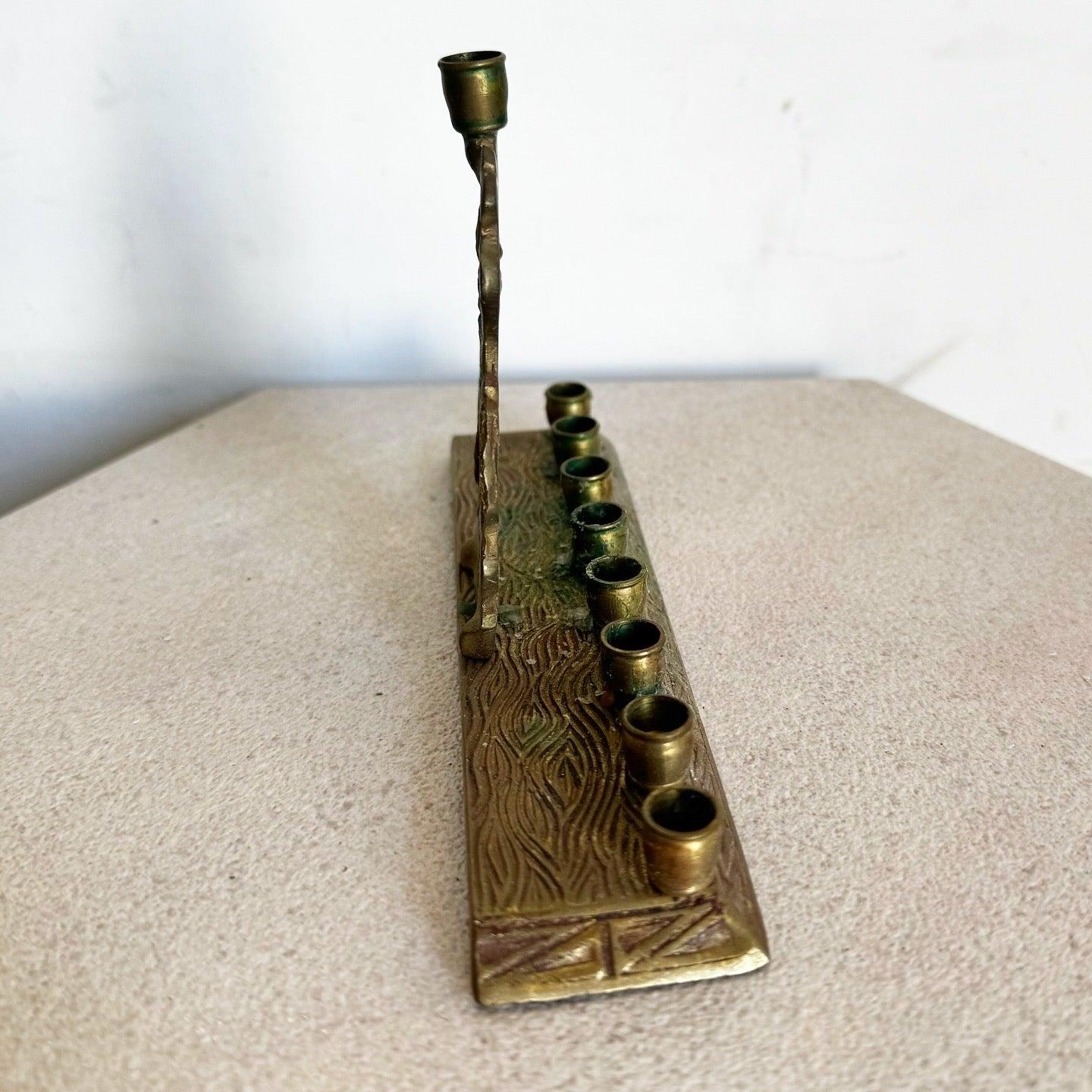 Vintage Brass Sculpted Shalom Menorah with polished finish and intricate details. Perfect for Hanukkah celebrations or as a decorative piece.
 
 We sell items as acquired, without restoring or repairing. Vintage pieces may have age-related wear.