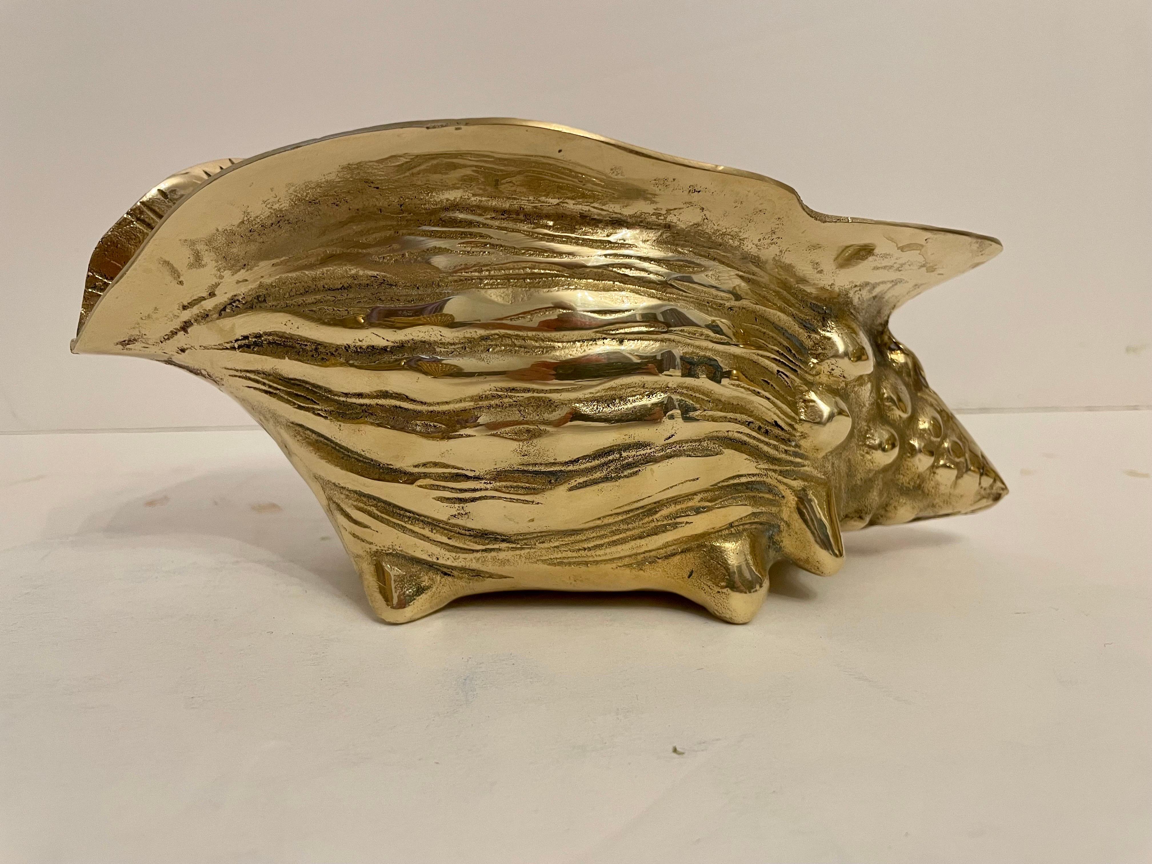 Hollywood Regency vintage brass seashell nautilus planter. Very detailed. Good overall condition with minor wear to from age and use. Can be used inside or out. Great for air plants. 9” wide x 4.5 wide x 4” tall.