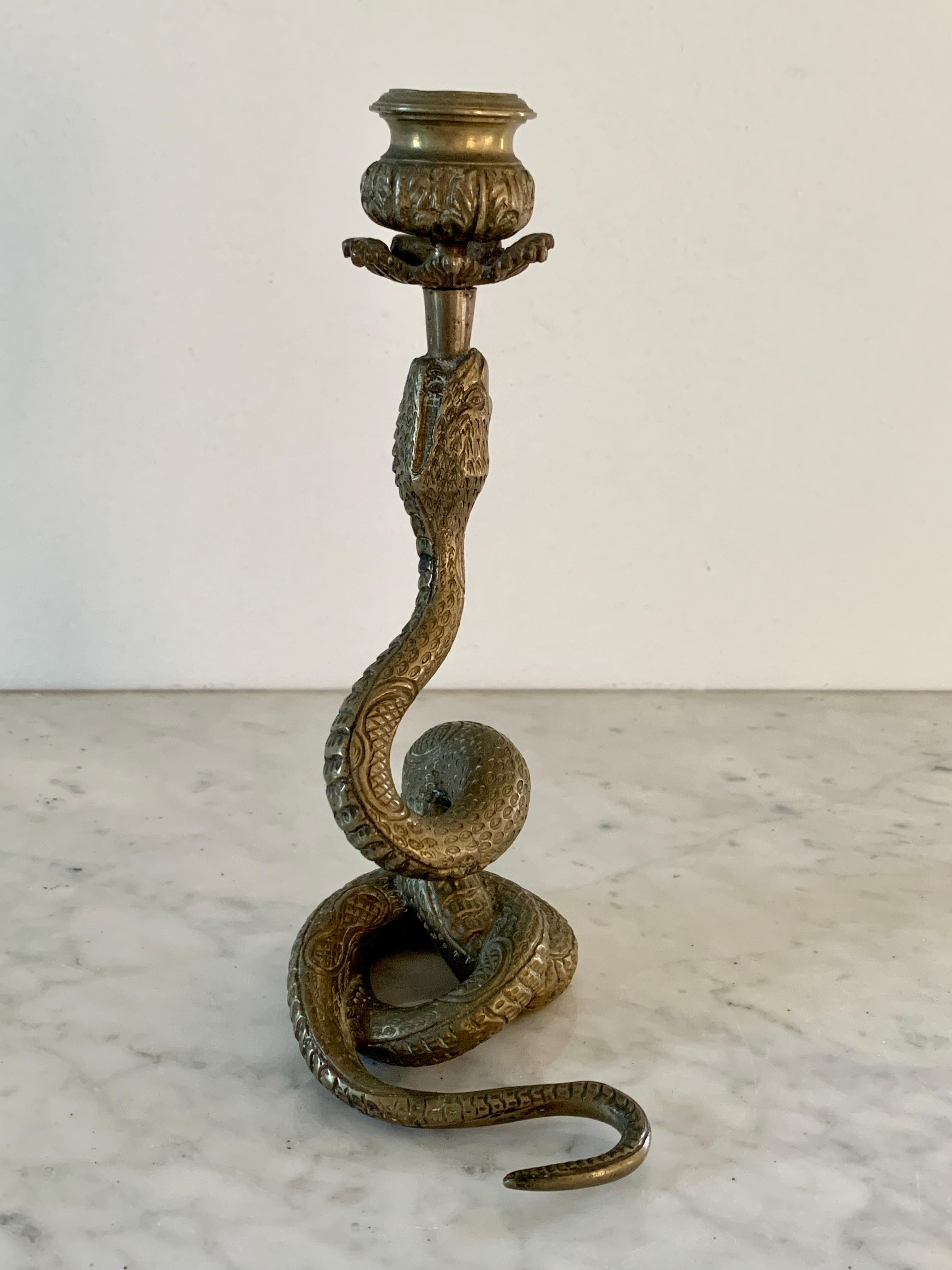 A wonderful Art Deco style brass snake candle holder.

circa mid-20th century

Measures: 4.75