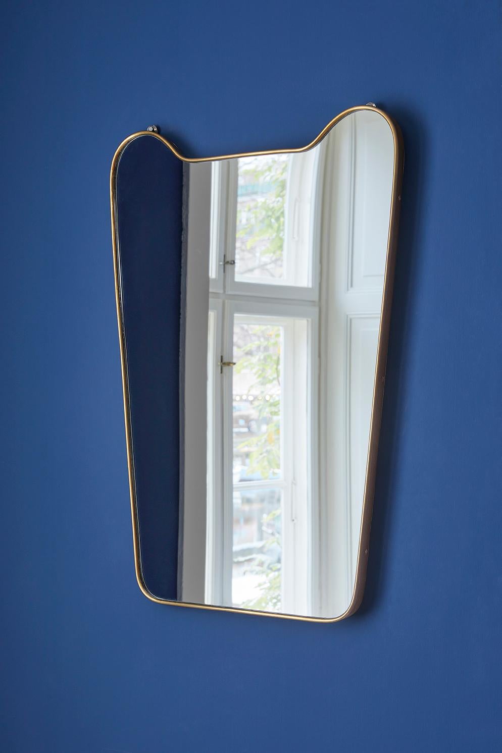 Italy, 1950's.

Brass mirror.

Measures: H 110 x W 50 x D 3 cm.
 