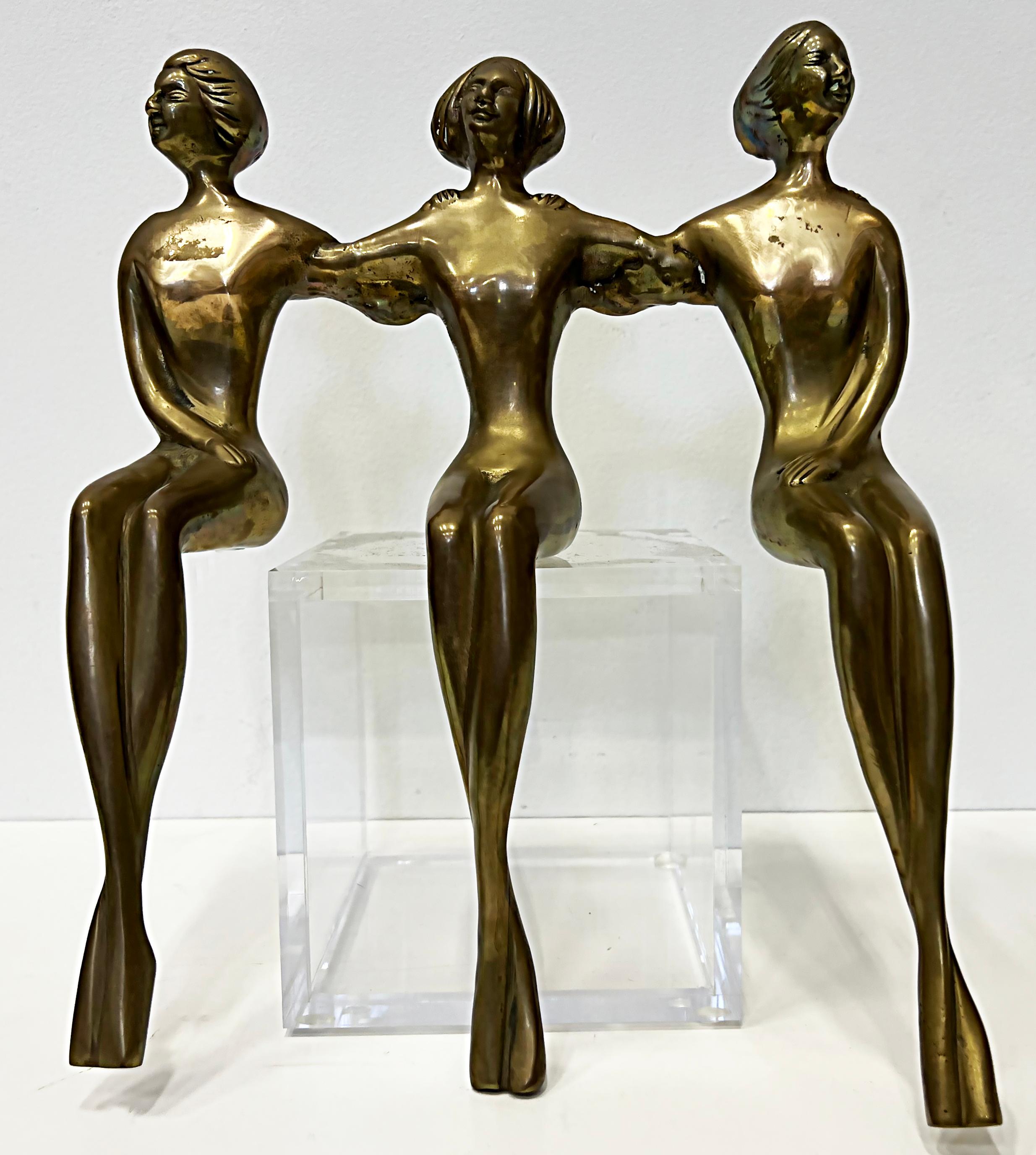 Vintage brass shelf sitter figural sculpture, 3 nude women

Offered for sale is a vintage brass shelf sitter figural sculpture of three women. The three nude figures are all connected with their arms around one another. They can be displayed on