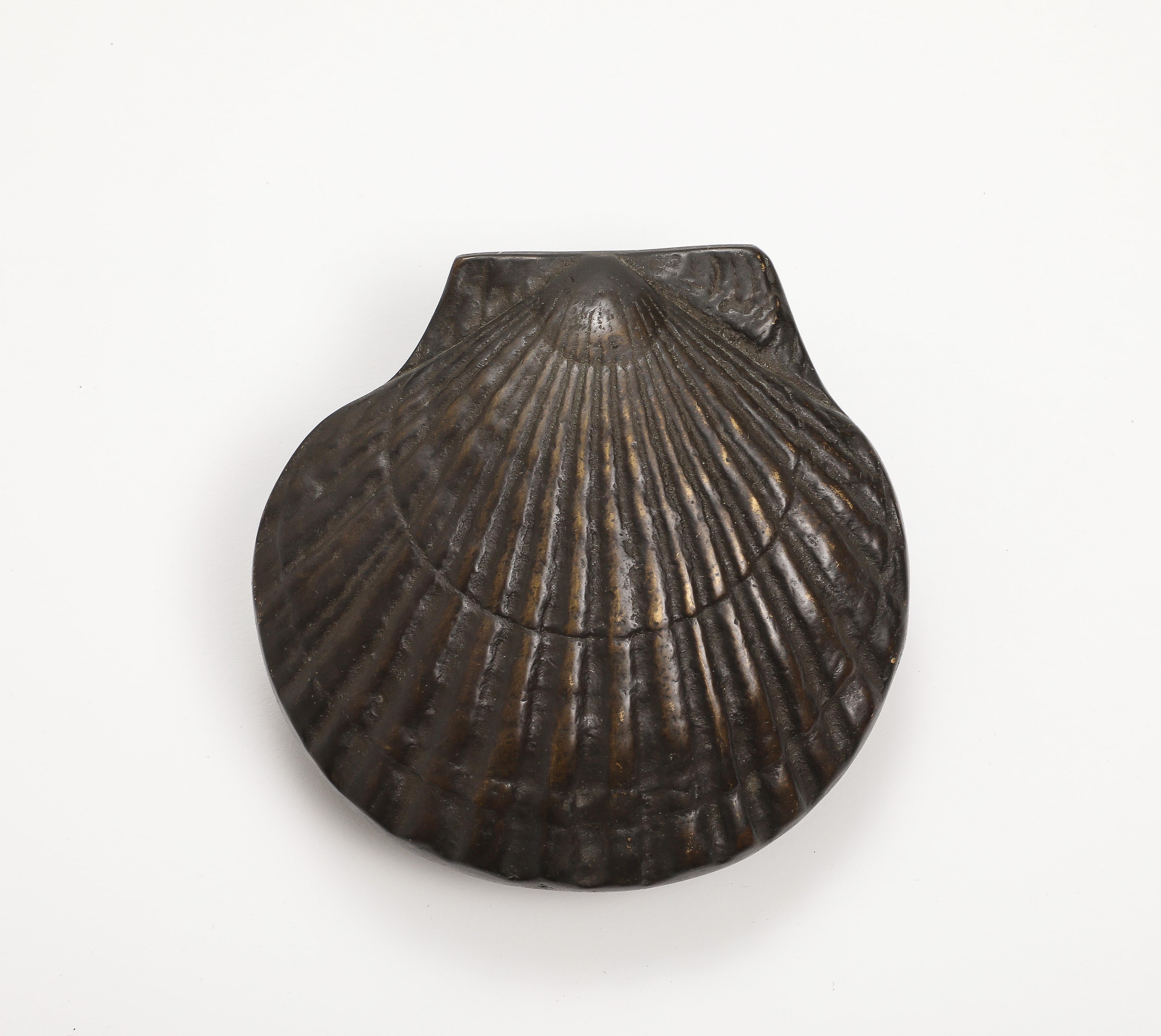 Vintage 20th century shell-form brass door knocker. 