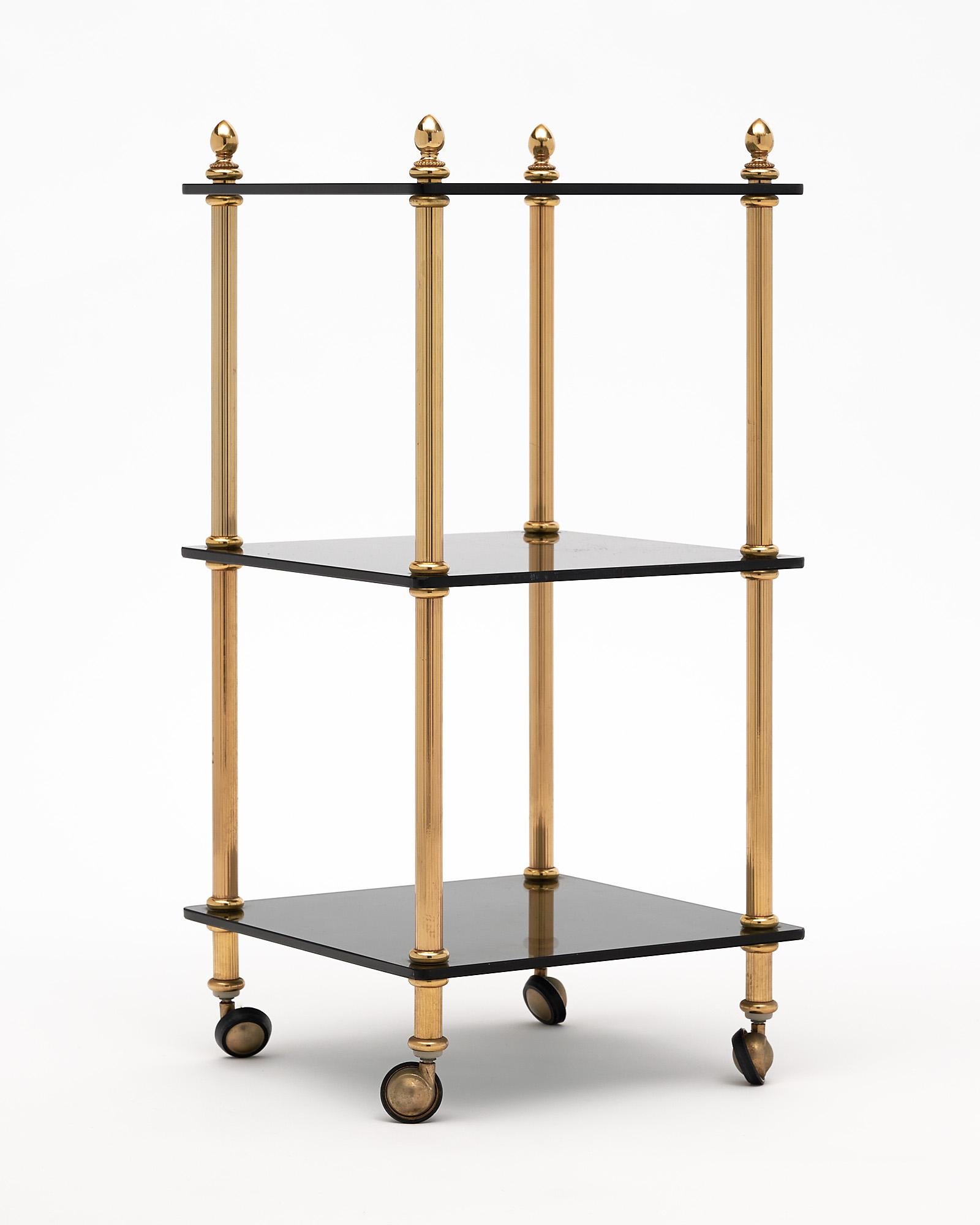 Three tiered side table, French, the piece features a gilt brass structure on casters and three cobalt glass shelves.