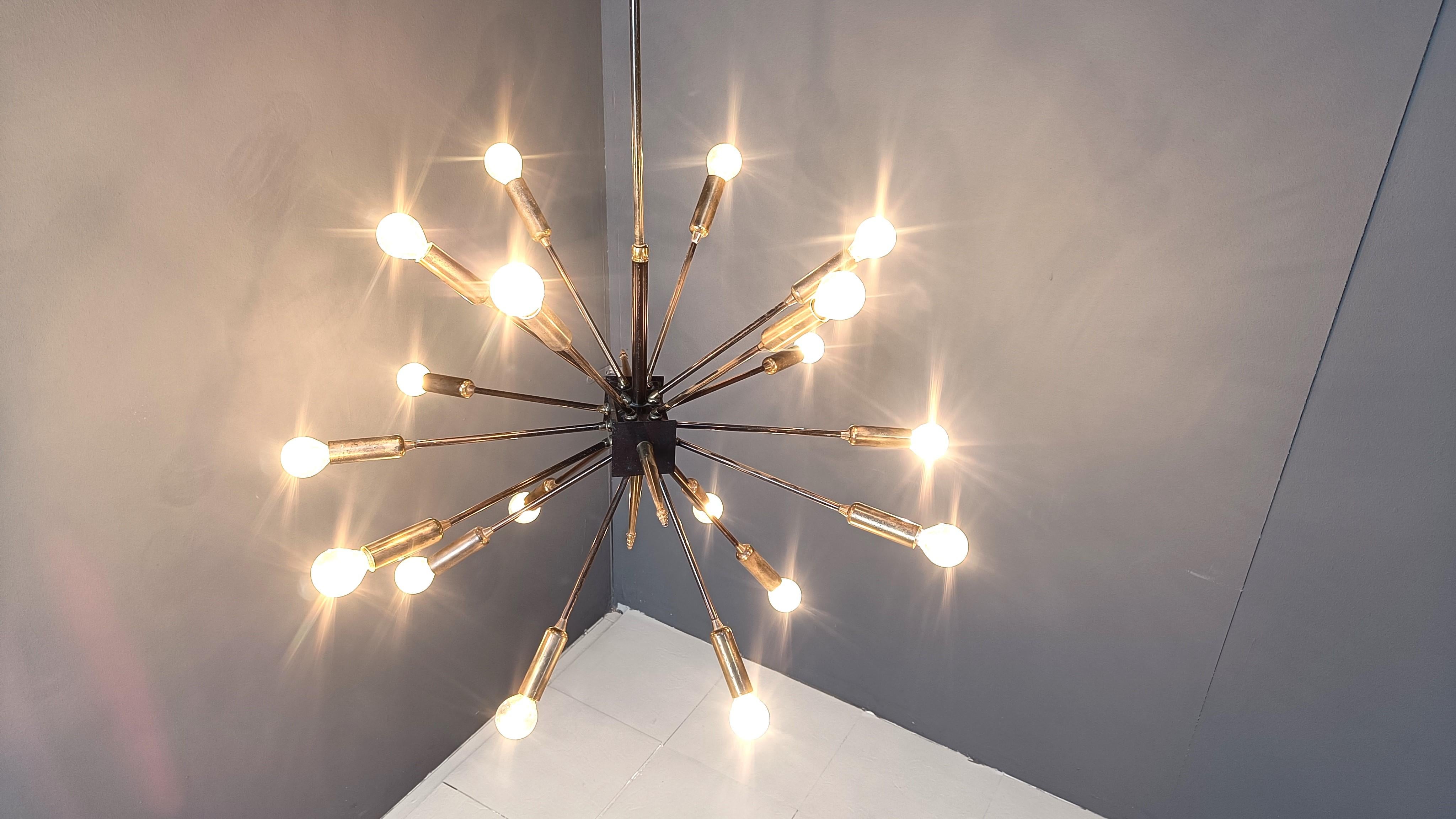 Spectacular 18 lightpoint sputnik chandelier.

The chandelier creates a stunning light effect.

Tested and ready for use. To be used with regular E14 light bulbs.

The chandelier is in good condition.

1970s - italy

Height: 120cm
Diameter:
