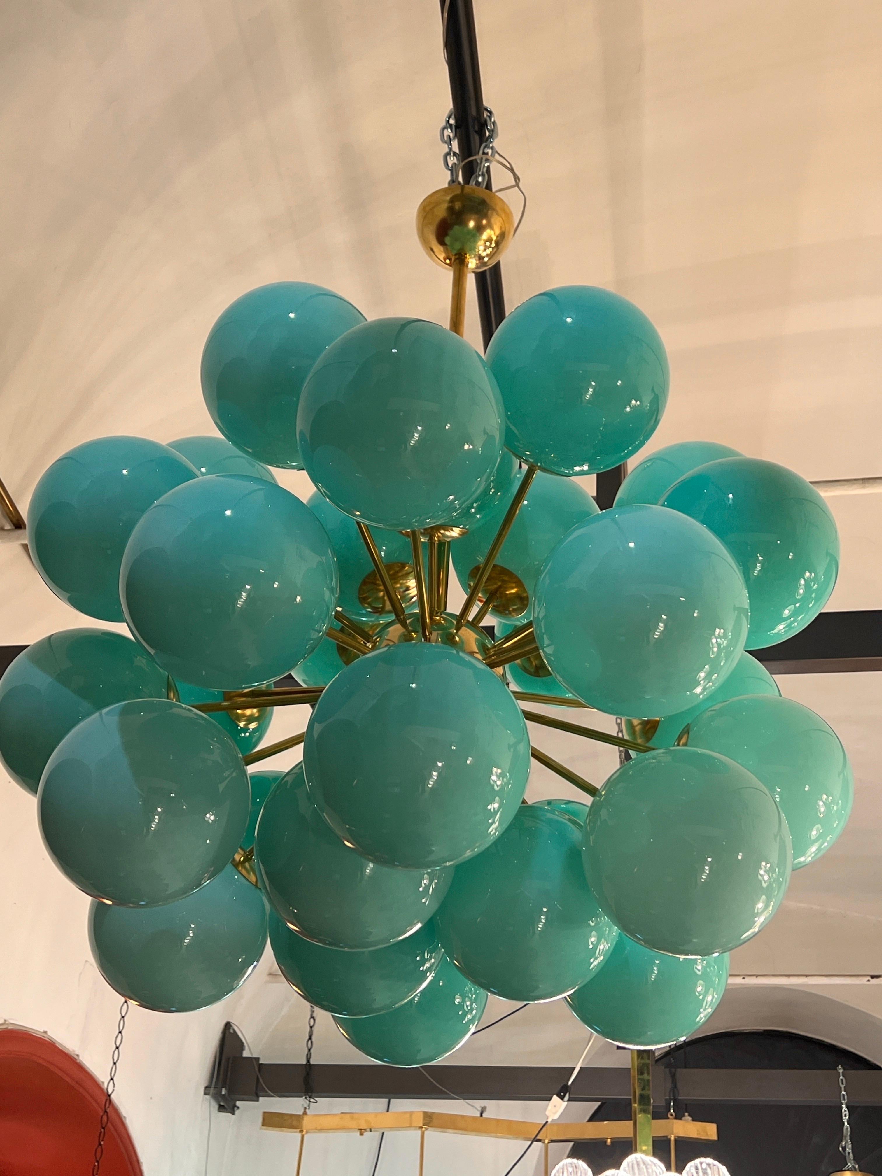 Vintage Brass Sputnik Chandelier with 30 Tiffany Green Glass Spheres. 
30 lights bulbs.
