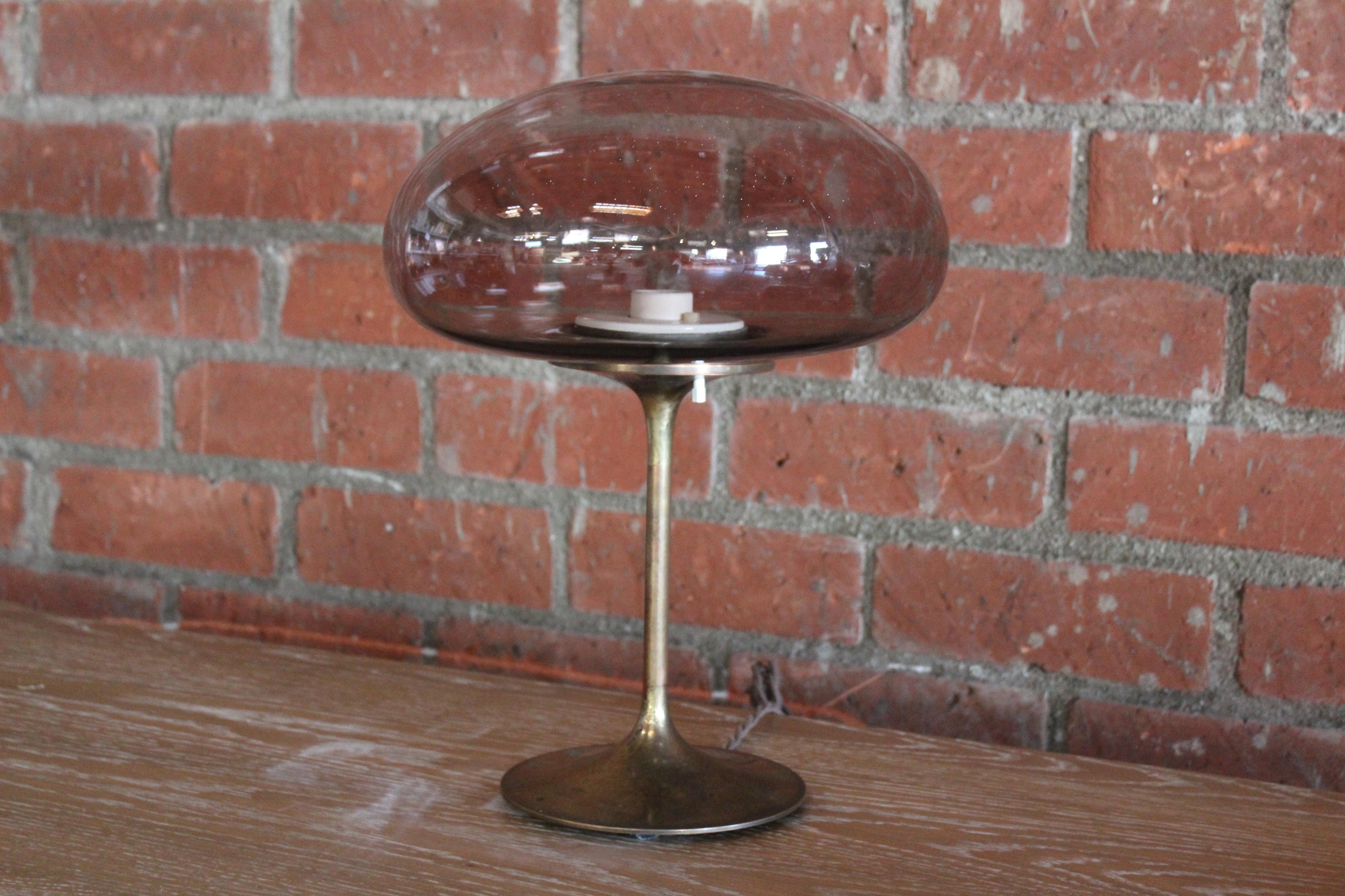 A vintage brass stemlite mushroom lamp by Bill Curry, manufactured in El Segundo, California in the 1960s. Features original smoked glass shade. Newly rewired. In overall wonderful condition with patina to the brass.