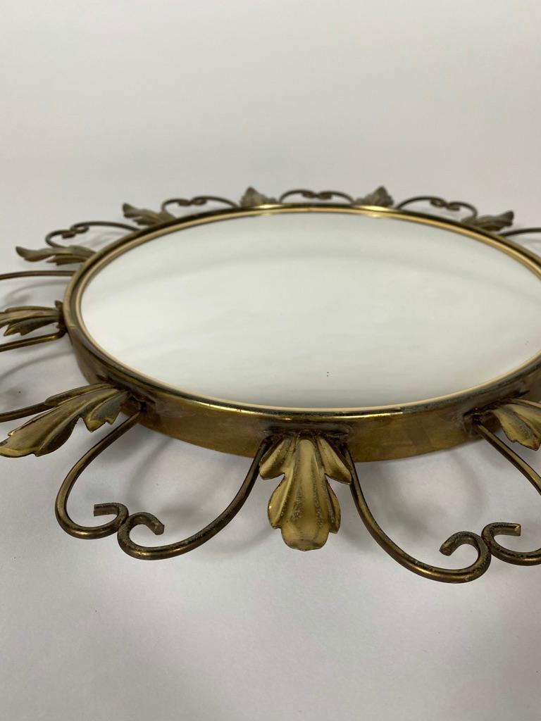Mid-century brass sunburst mirror with convex glass in Hollywood regency style. The mirror has patinated brass flowers and leaf motifs, 1960s, Belgium
- Measures: Diameter: 44.5 cm
- Diameter of glass: 30 cm.