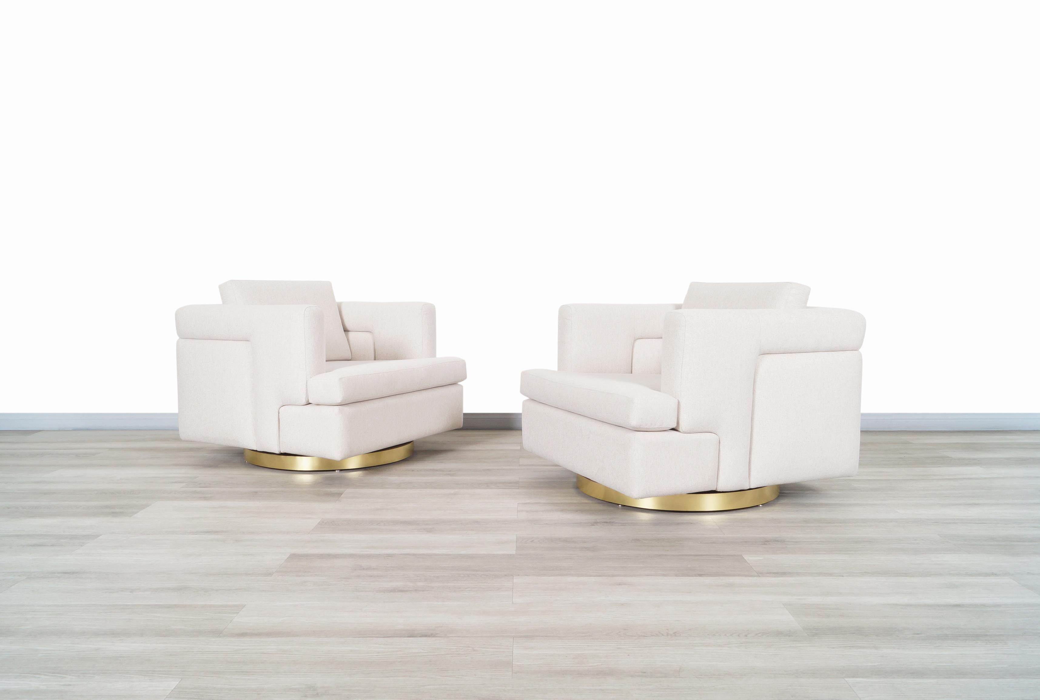 Stunning vintage brass swivel lounge chairs and ottoman designed by Hayes Furniture in Oakland, California, circa 1970s. This set is inspired by the iconic designs of the famous designer Milo Baughman, both the chairs and the ottoman have an