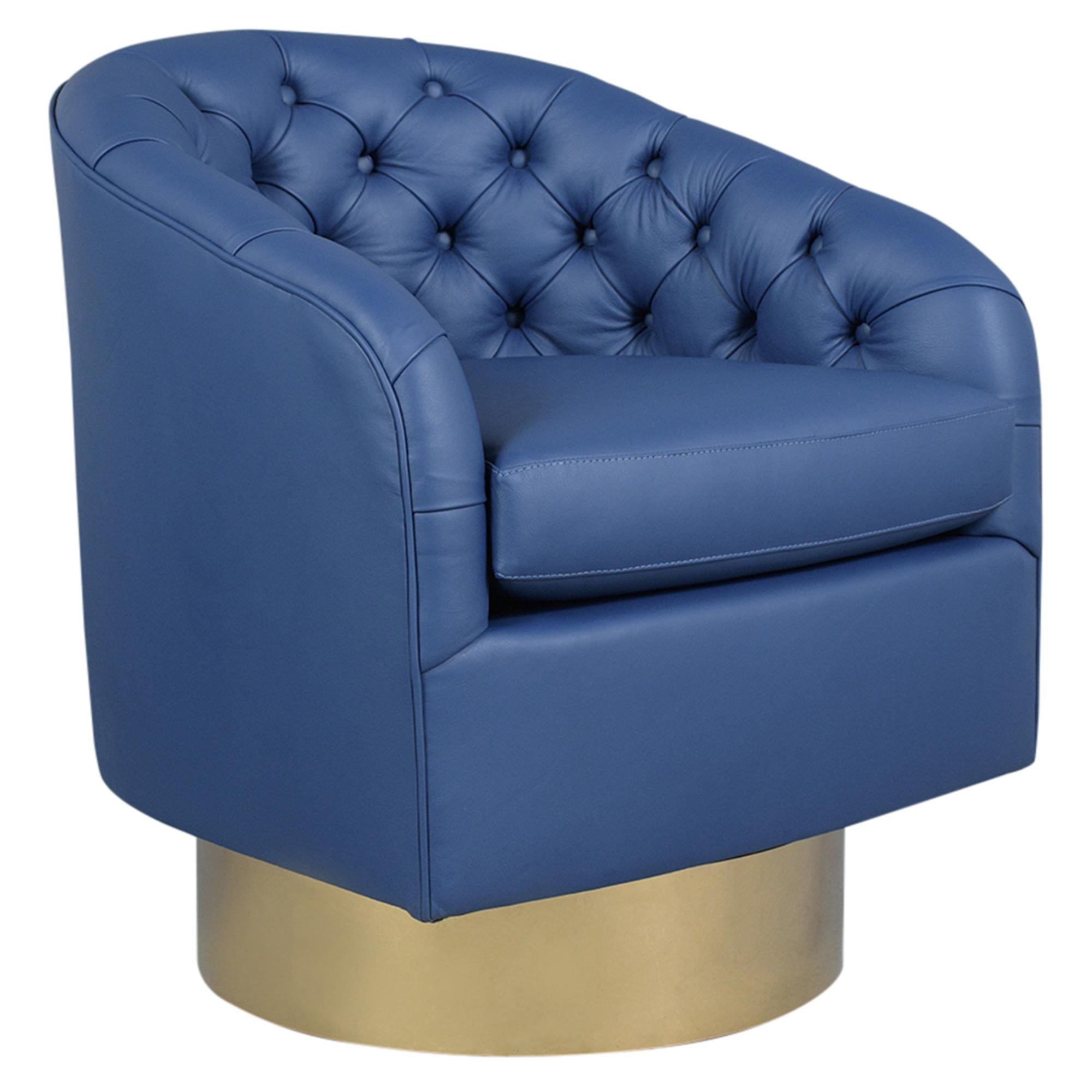 Immerse yourself in the elegance of mid-century modern design with our pair of vintage brass swivel lounge chairs, inspired by the iconic Milo Baughman. These chairs have been meticulously reupholstered in sumptuous blue leather by our team of