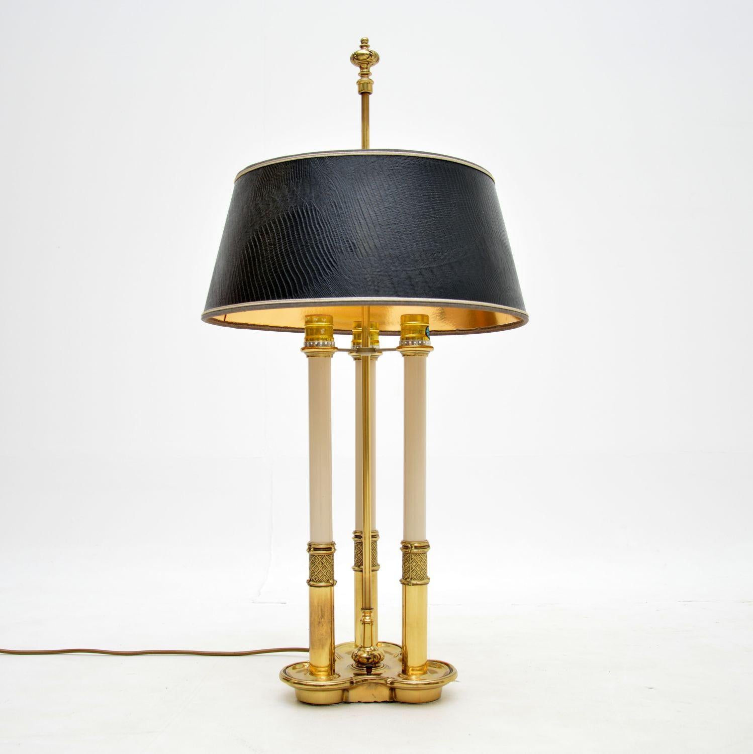An absolutely stunning vintage table lamp in solid brass. This was made in the USA by Stiffel, it dates from around the 1970’s.

The quality is outstanding, this is a large and impressive size. The shade is imitation snakeskin, it can be raised