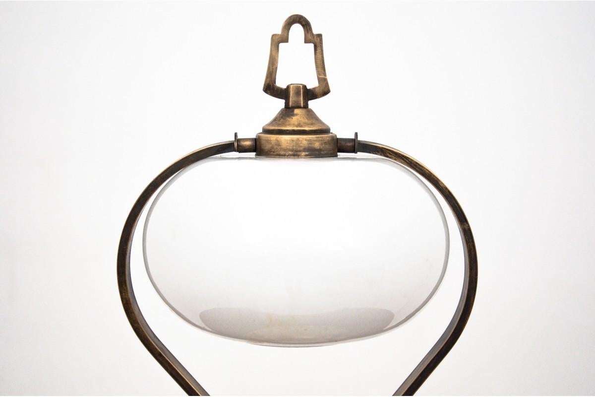 A lamp from the 1950s.

Year: circa 1950

Origin: Poland

Material: brass, glass.