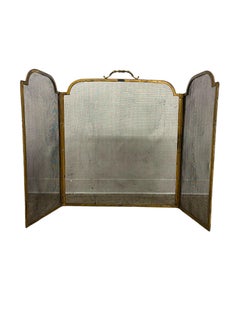 Vintage Brass-Toned Fireplace Screen with Folding Mesh Panels and Ornate Handle.