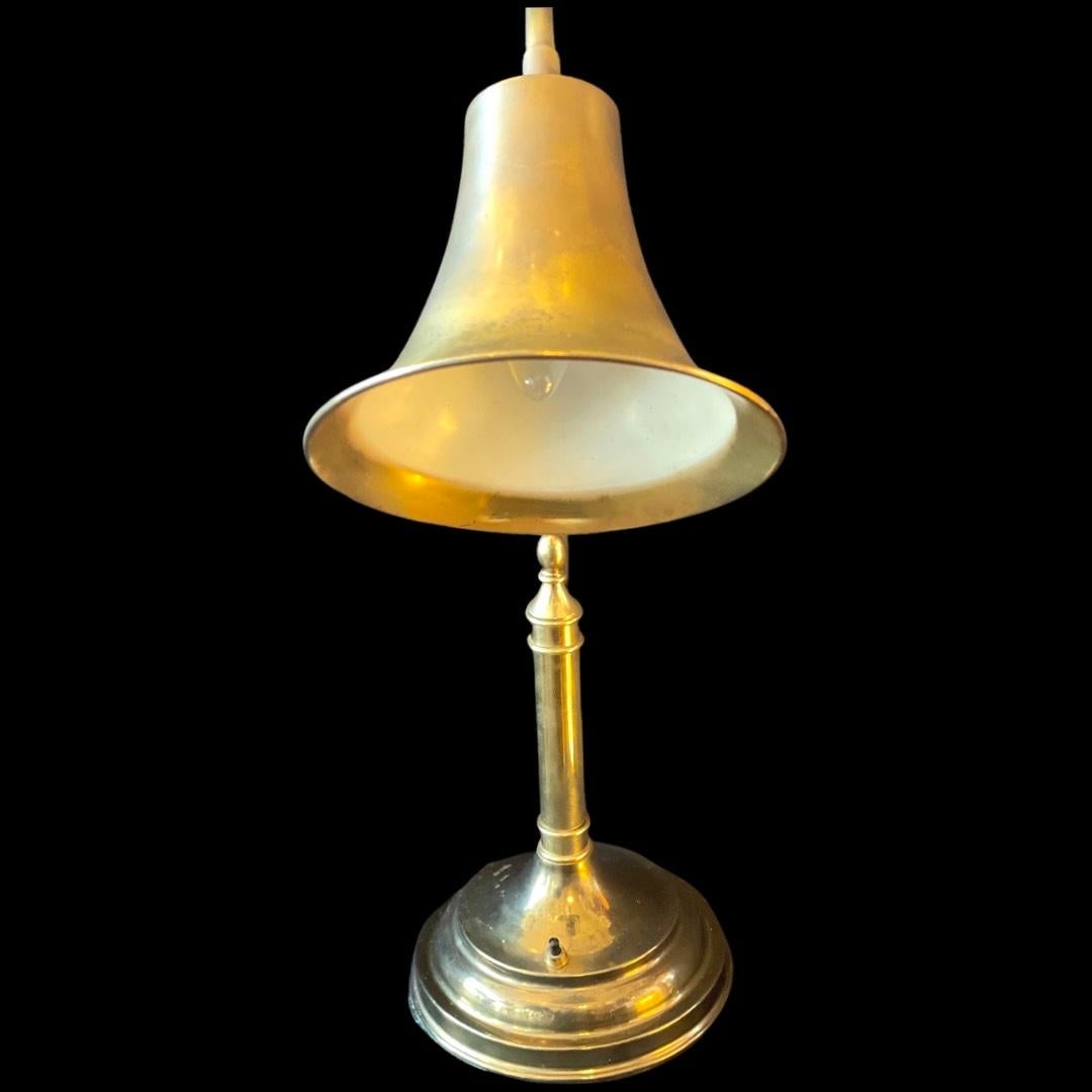 Classic 1970's Brass Arched Arm Trumpet Style Desk Lamp.
This stylish brass lamp is a perfect fit for a nice office or desk, also works well on a side table or corner table in living spaces.

The head of lamp is on a ball neck joint allowing you to