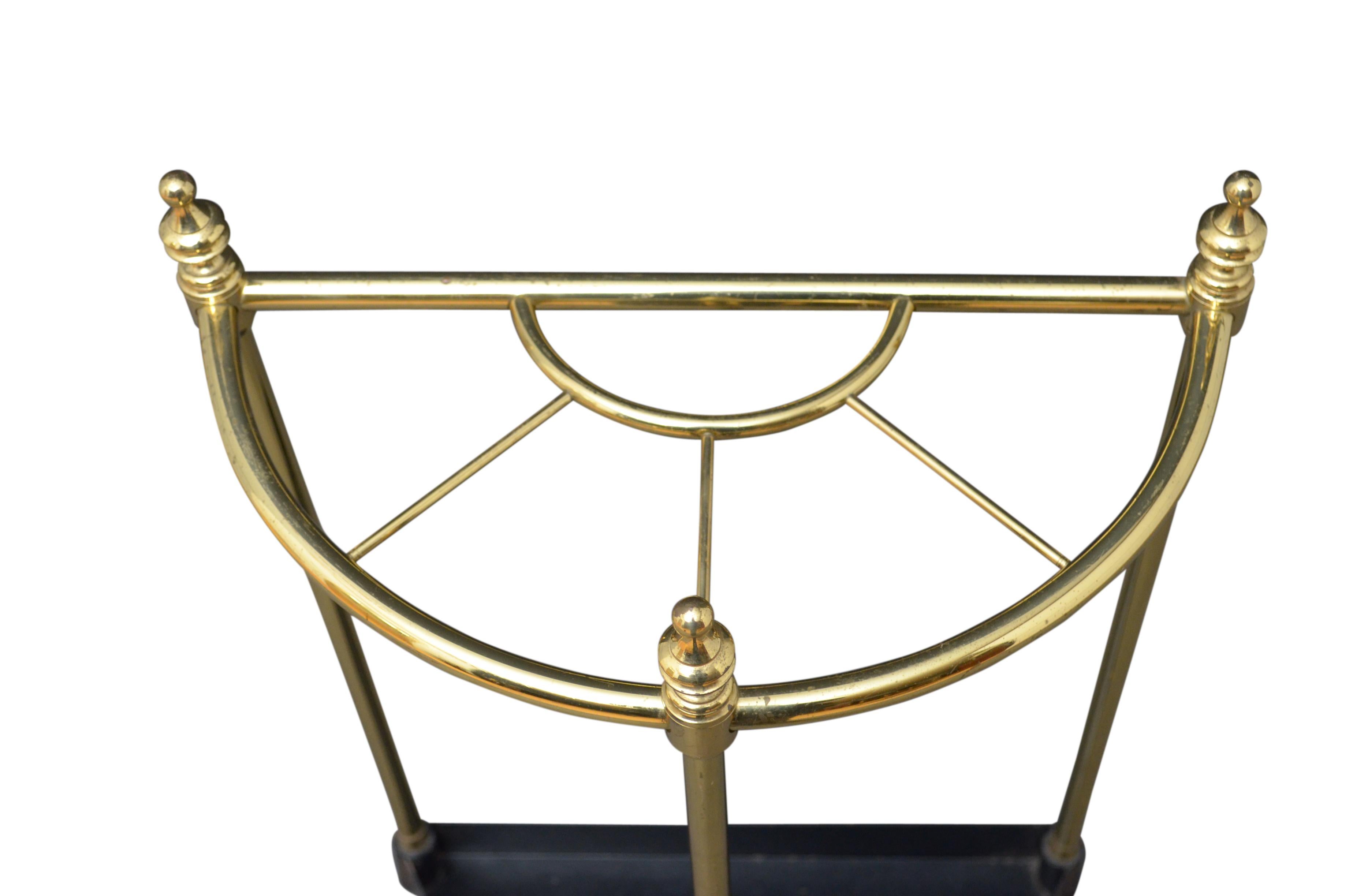 Vintage demilune, brass stick stand with 4 sections, decorative finials and shaped drip tray. This umbrella Stand is in original condition, retaining original lacquer and signs of usage, circa 1940.
Measures: H 25