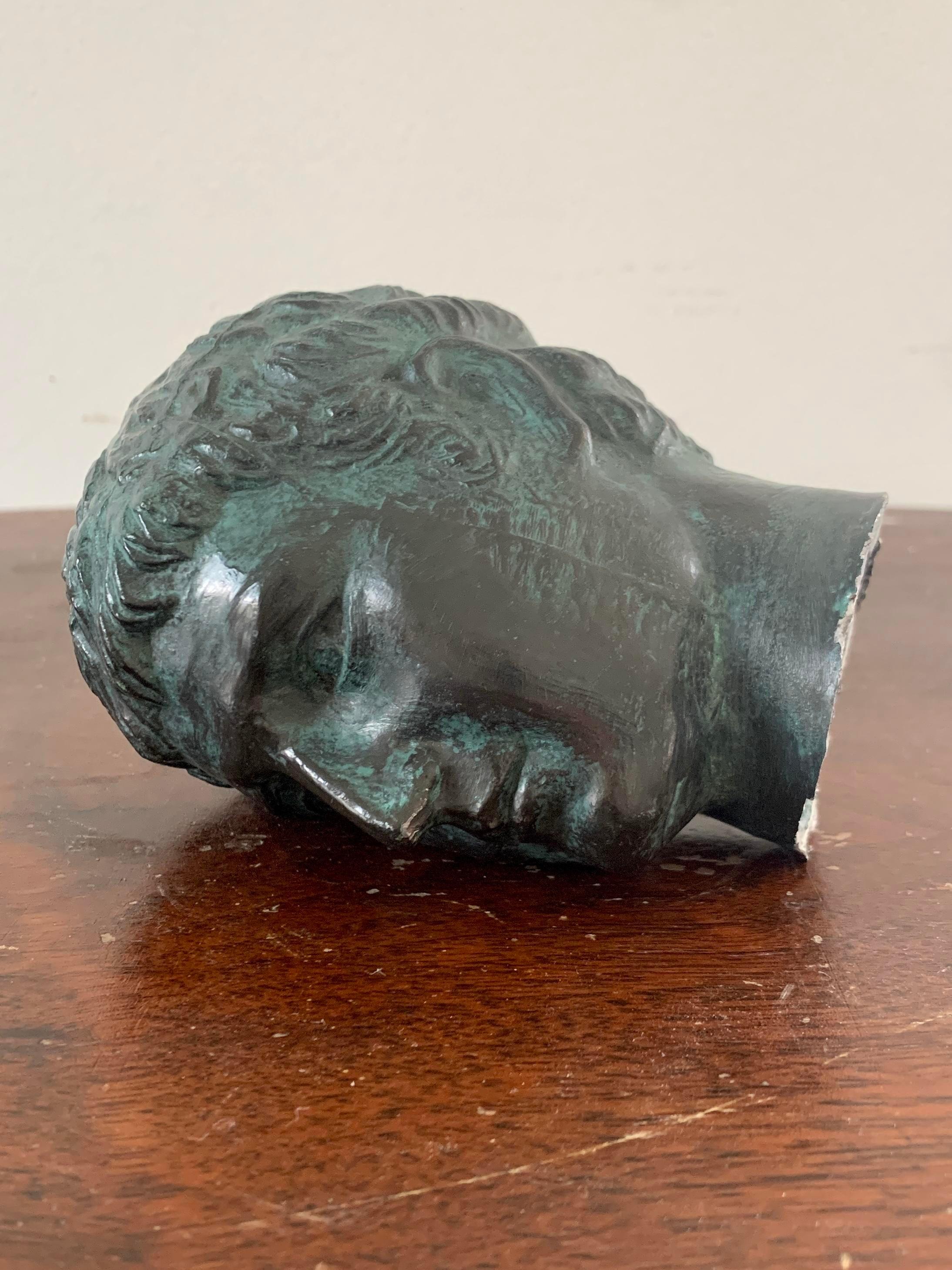 A gorgeous brass verdigris Grand Tour classical style male head bust sculpture

USA, Late 20th century

Measures: 3.75