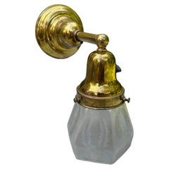 Antique brass wall sconce with vintage etched glass shade