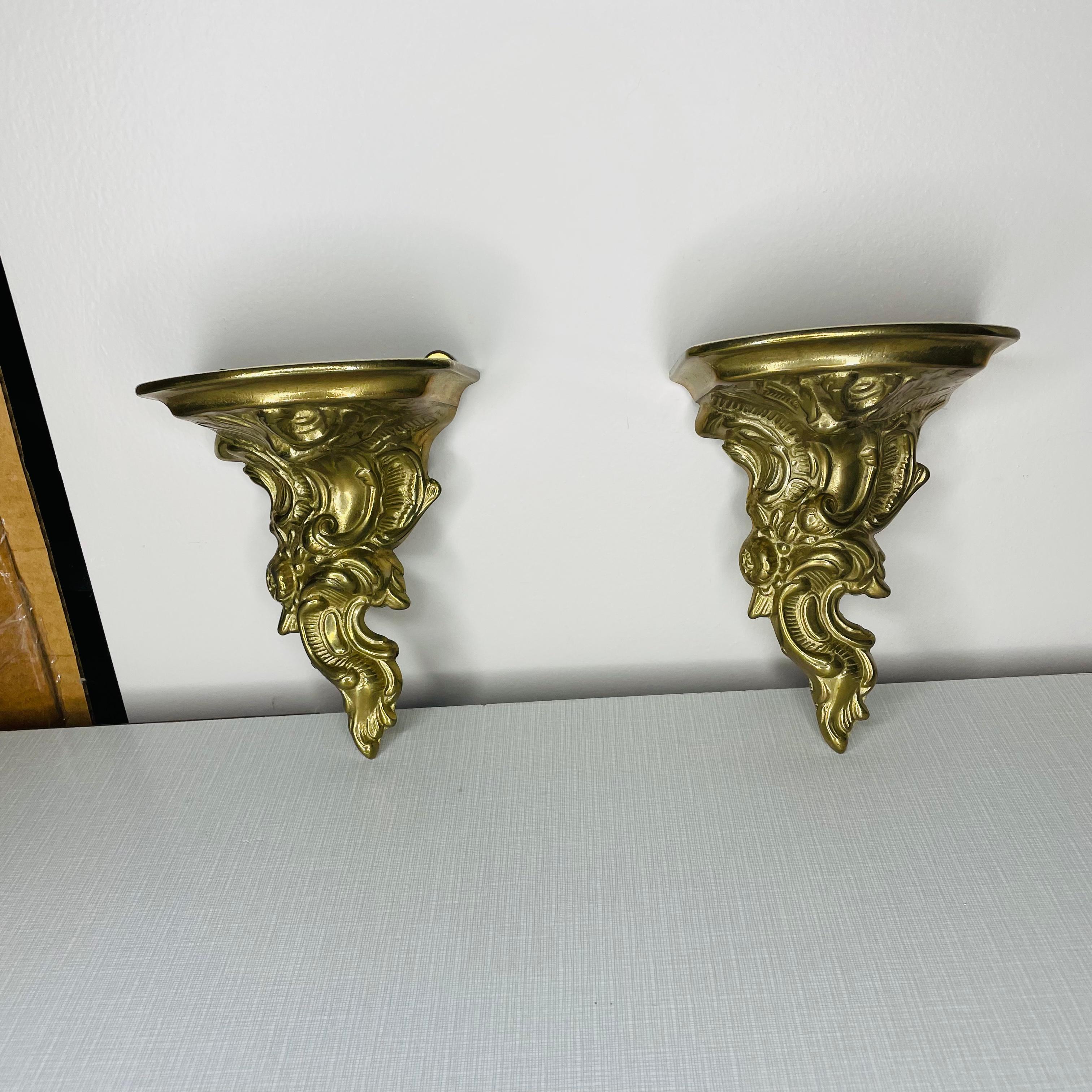Pair of brass wall shelves in great condition. The face of each shelf has a nice patina, however the tops have been polished.