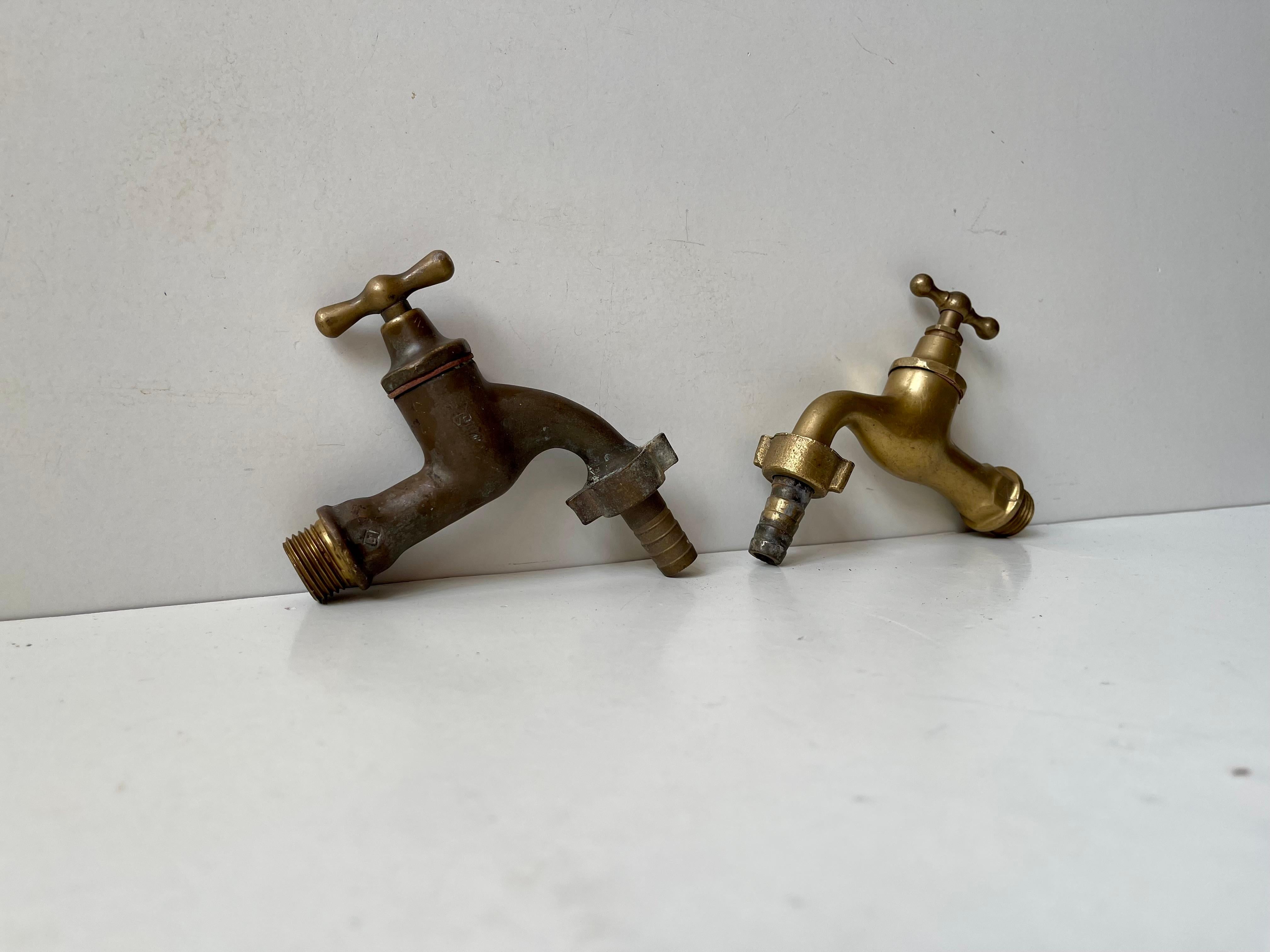 A set of 2 solid brass water faucets. Both tested and in working order. They also come with original hose connectors/adaptors. Made in Europe, probably Scandinavian/Sweden circa 1930s-50s. Your midcentury, 1930s/40s Bauhaus or Funkis House deserves
