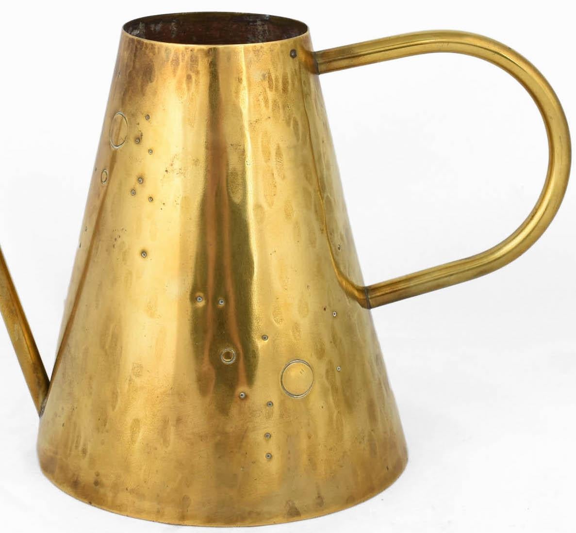 Vintage brass watering can is an original decorative object realized between 1950s and the 1960s.

Original brass product.

Handmade in Germany.

HS mark is present on the base. 

Good conditions: Vintage signs of age are