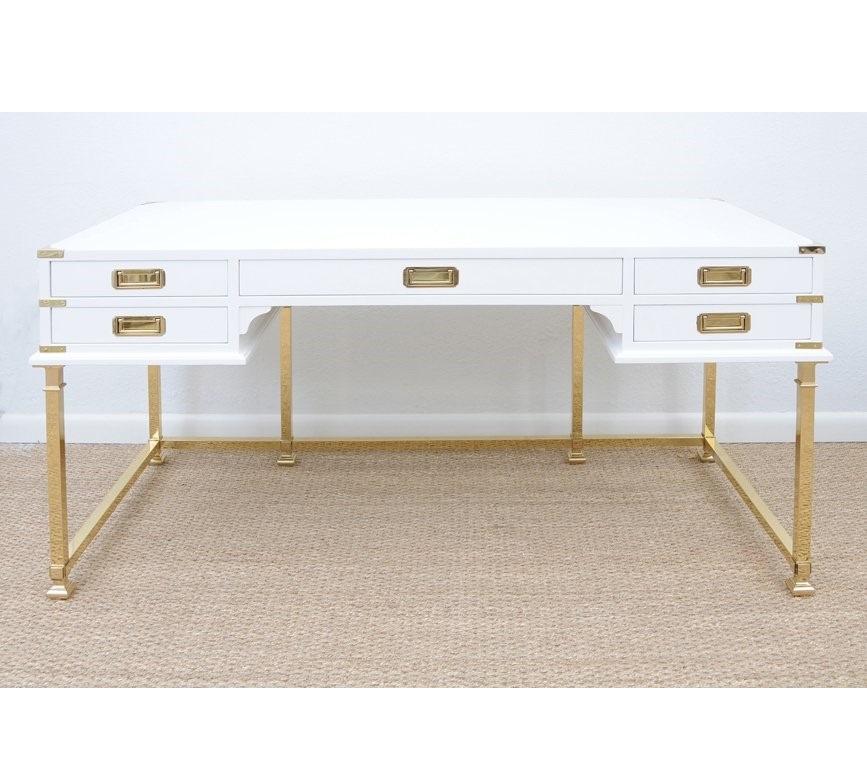 Classic Campaign style desk manufactured by Sligh of Holland/Grand Rapids, Michigan. Consist of five drawers with recessed brass pulls and brass legs. Brass bound corners and Campaign pulls contrast nicely with the white lacquer. Restored, finished