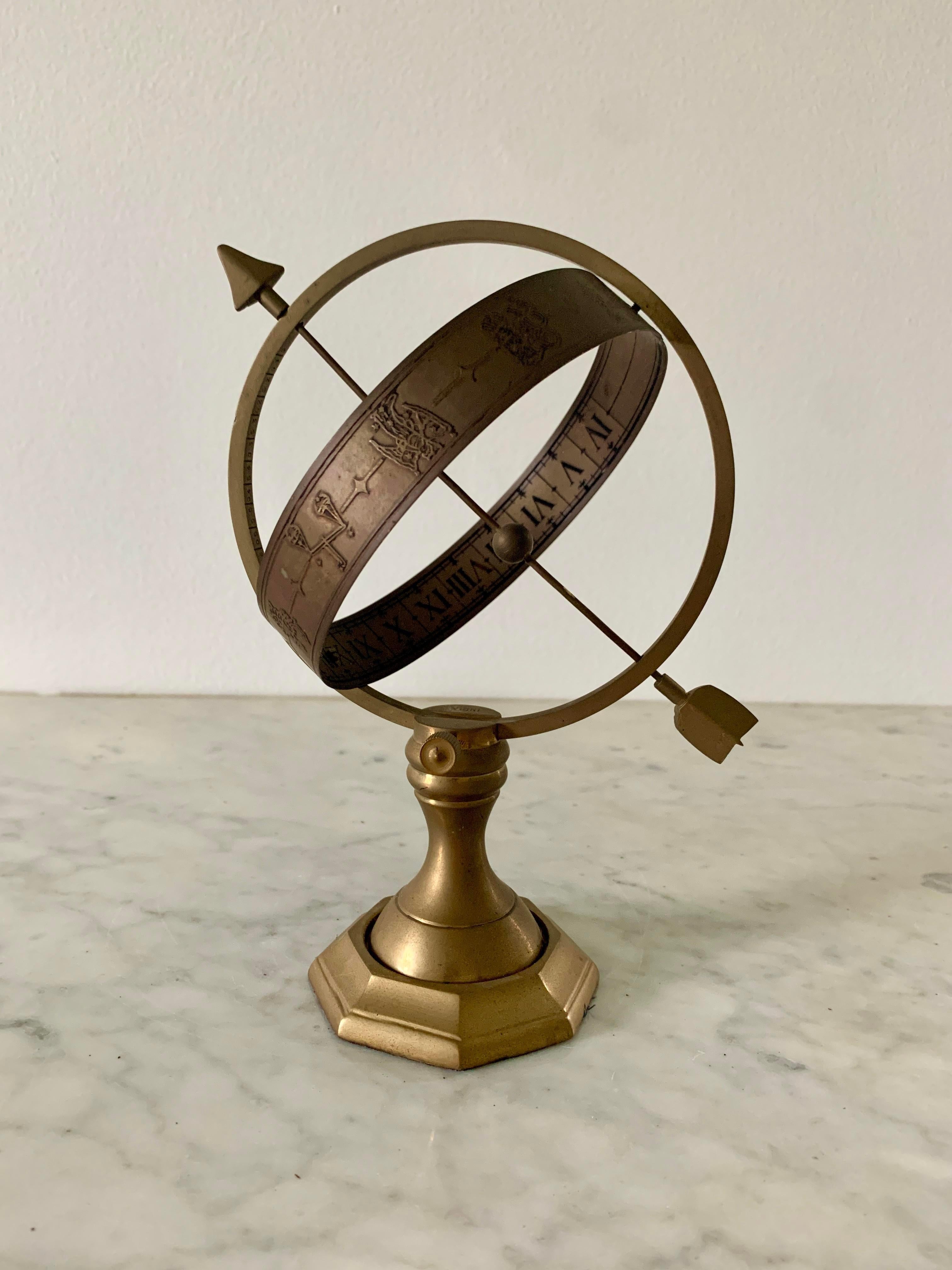 A stunning vintage brass armillary sundial featuring Roman numerals and the zodiac signs.

Late 20th century.

Measures: 6