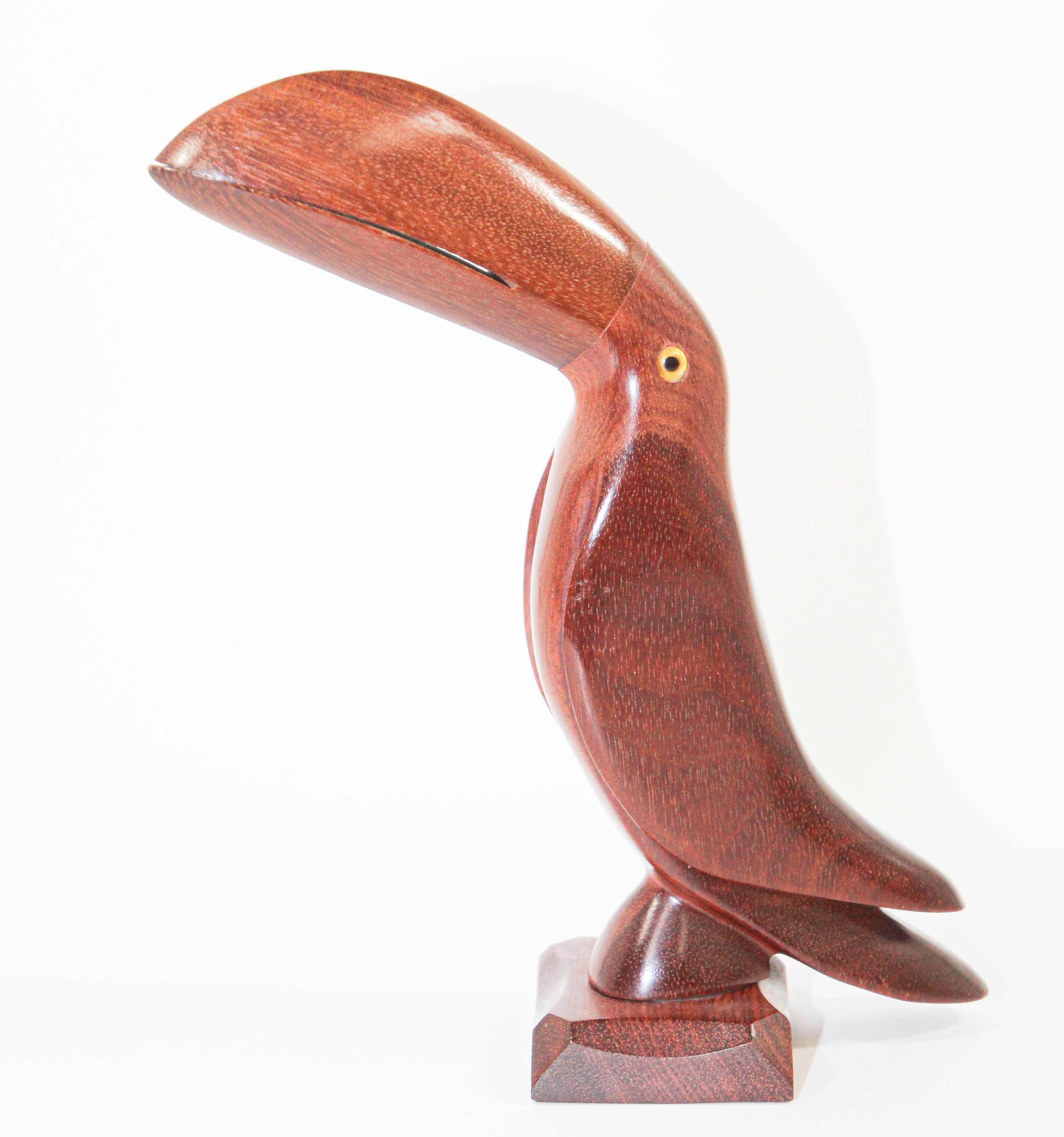 Beautiful Hand carved Ironwood birds perched on wood pedastal