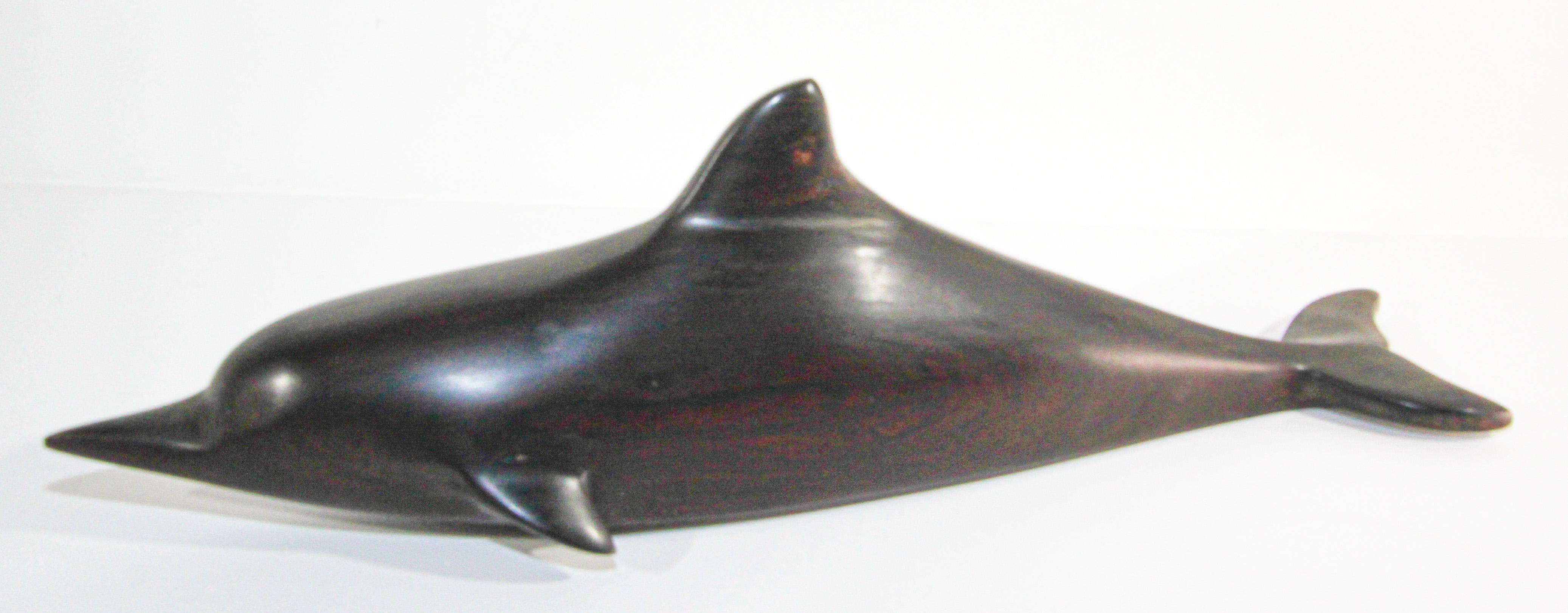 Vintage Brazilian hand carved Ironwood sculpture of a whale and a shark.
Hand carved Brazilian sculpture hand crafted in amazing detail from one of earth's hardest natural ironwood. 
These are authentic art pieces crafted of Brazilian ironwood.