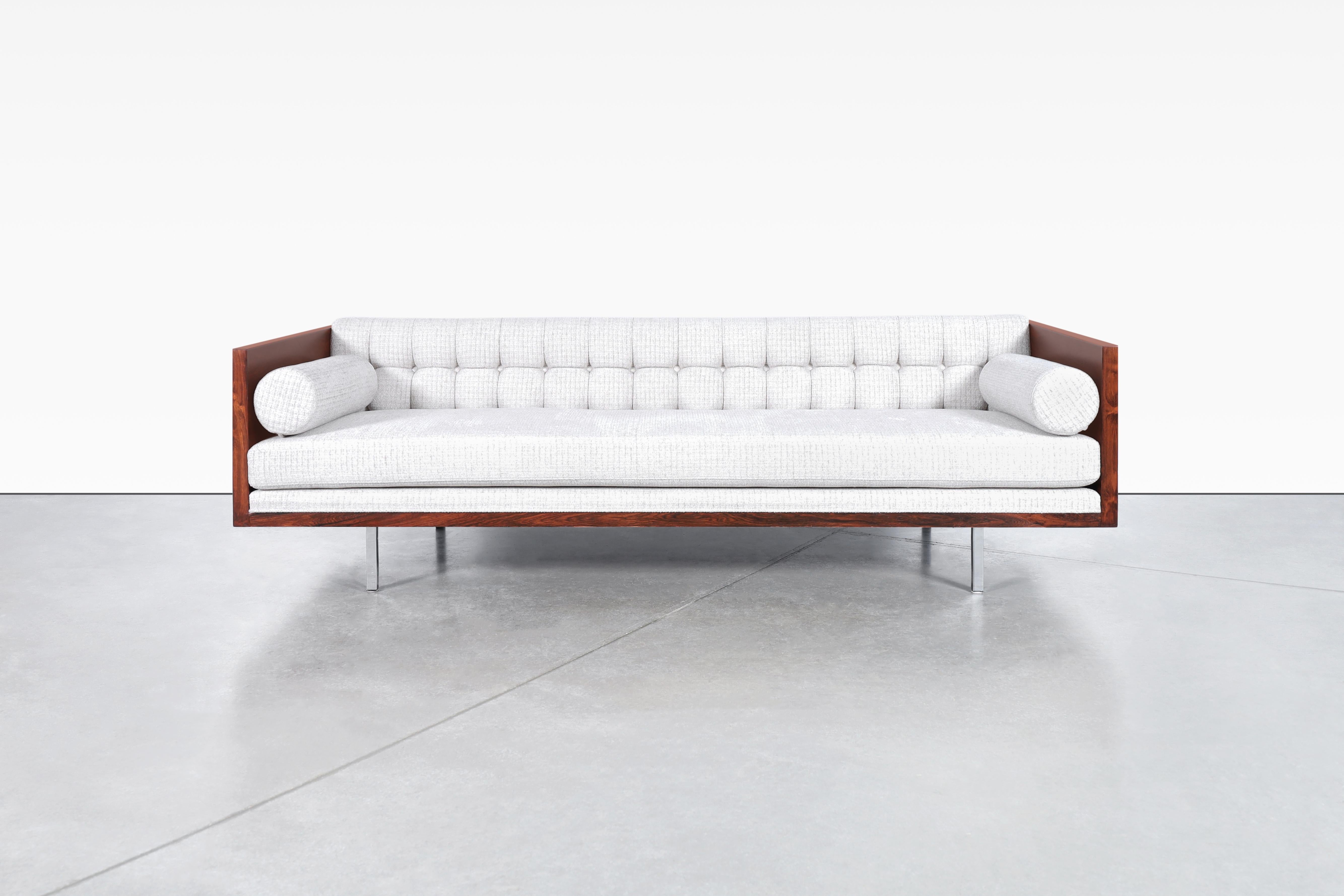 Vintage Brazilian rosewood case sofa designed by the iconic designer Milo Baughman for Thayer Coggin in the United States, circa 1960s. Experience timeless elegance with this stunning Brazilian rosewood sofa, expertly refinished and reupholstered by