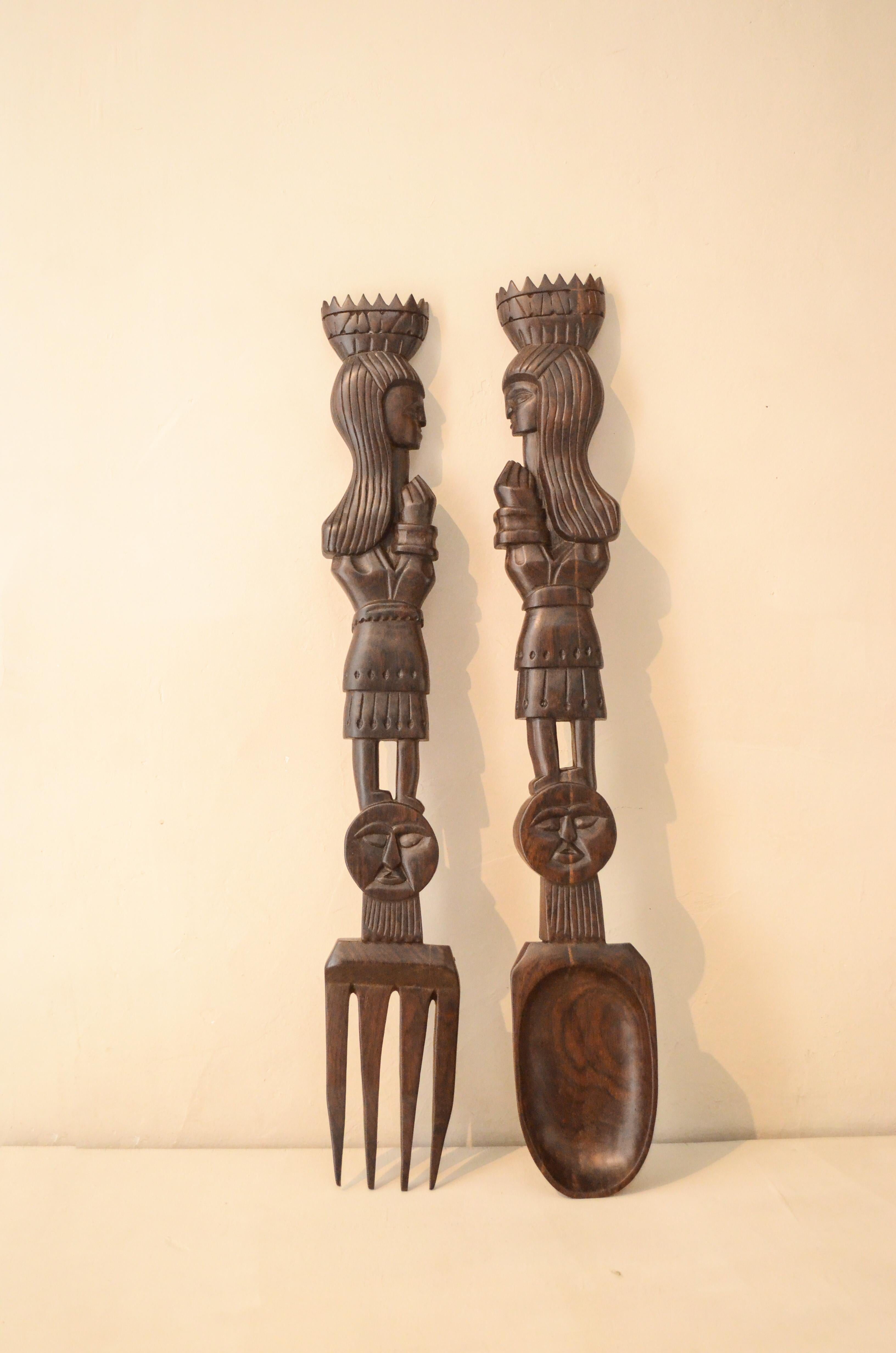 Vintage pair of wall-mounted cutlery carved in solid Brazilian rosewood.