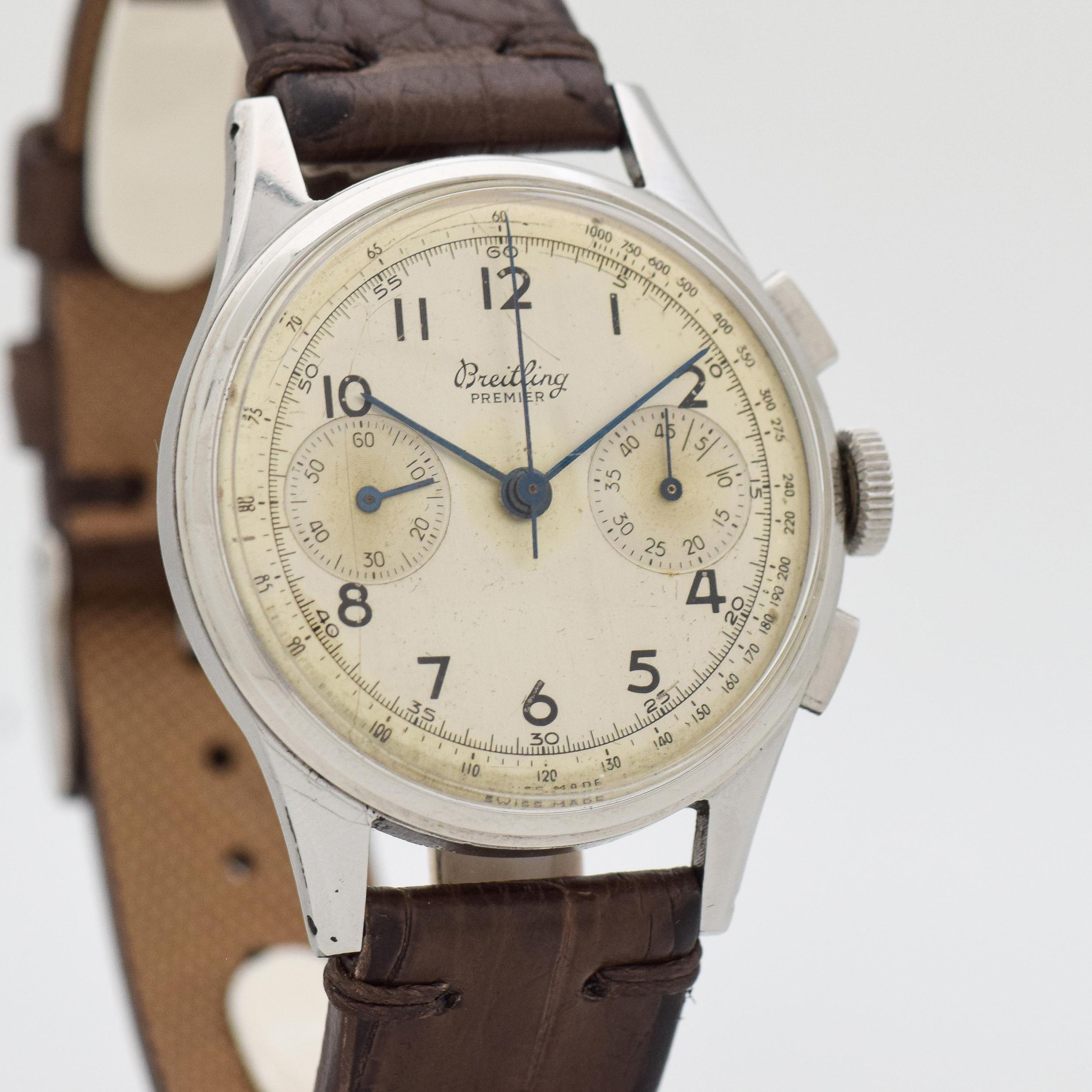 1945 Vintage Breitling Premier Ref. 760 Stainless Steel watch with Original Silver Dial with Painted Arabic Numbers. Case size, 36mm x 43mm lug to lug (1.42 in. x 1.69 in.) - Powered by a 17-jewel, manual caliber movement. Triple Signed.
