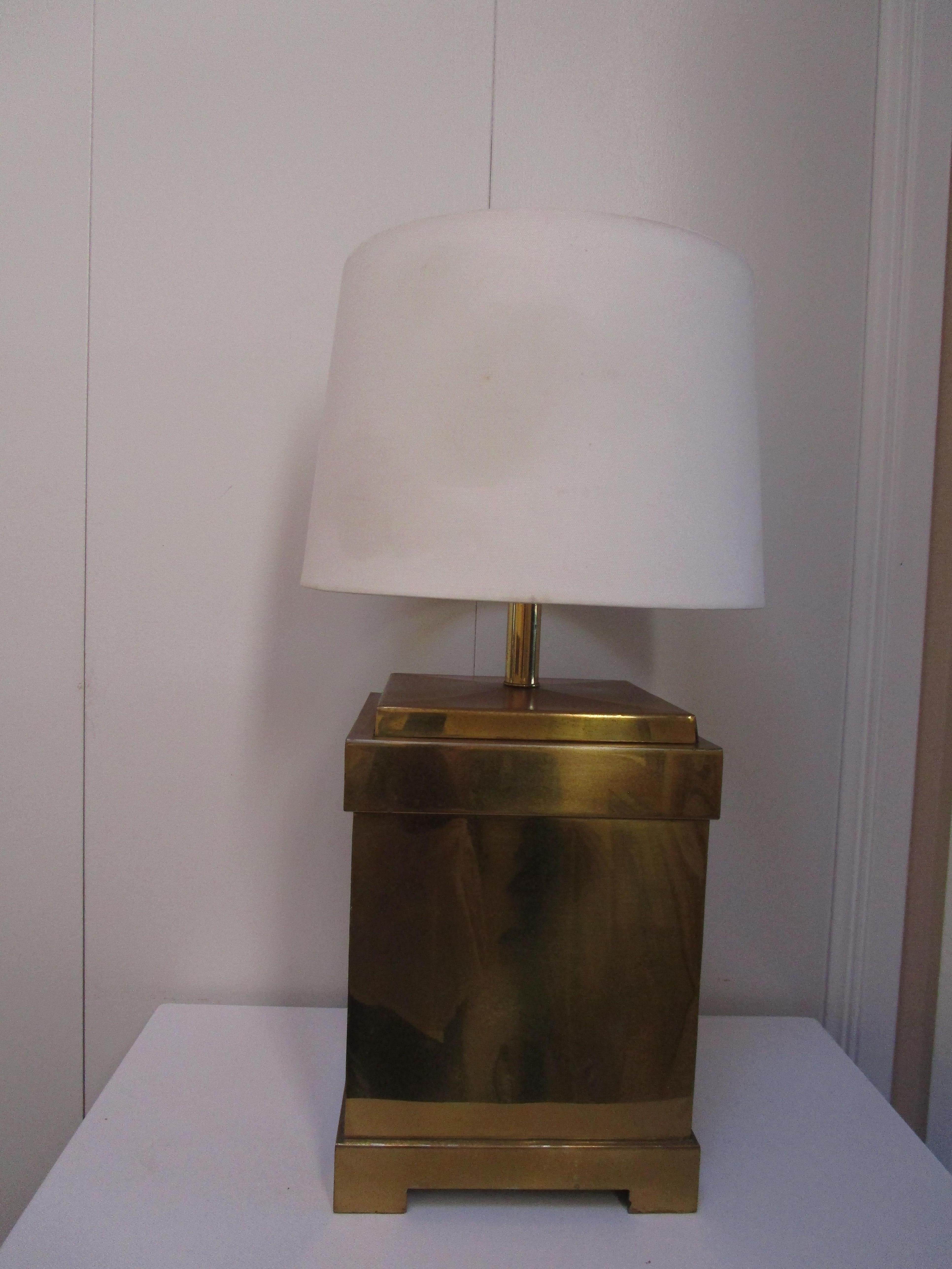 This is an incredible lamp with a geometric or architectural feel. It has the Remington label on it, a lamp maker from the Hollywood Regency period. But it also has a label that says it was produced in Hong Kong. The lamp is of the period and shows