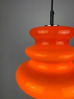 One of five Vintage Bright Orange Glass Pendant Light by Peill and Putzler 1960