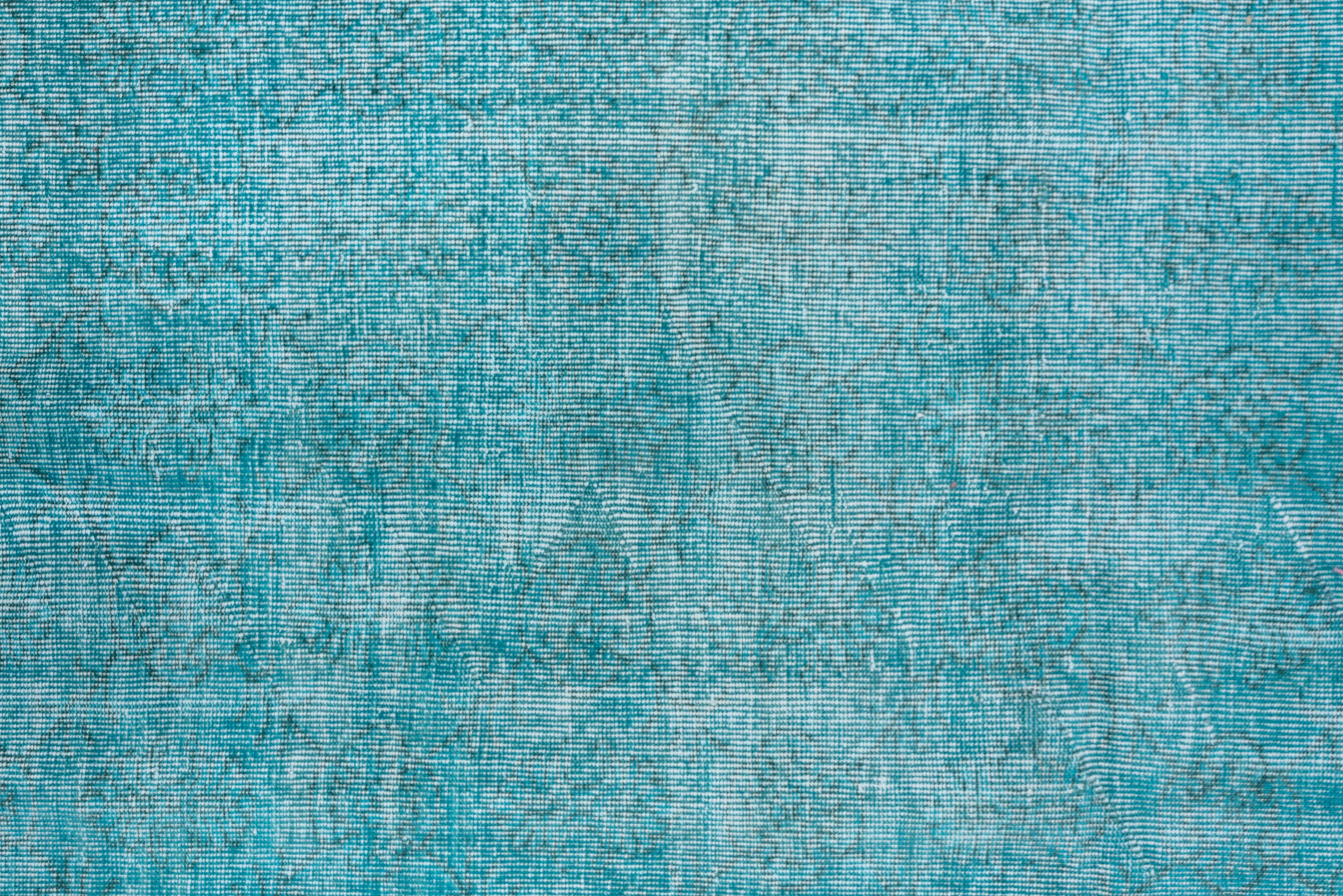 This bright turquoise Turkish overdyed carpet has a pattern defined by the wear beyond the all-over general distress. Vertical and horizontal off white strips cross near the center. Shabby chic conditions and can offer some great texture for floor