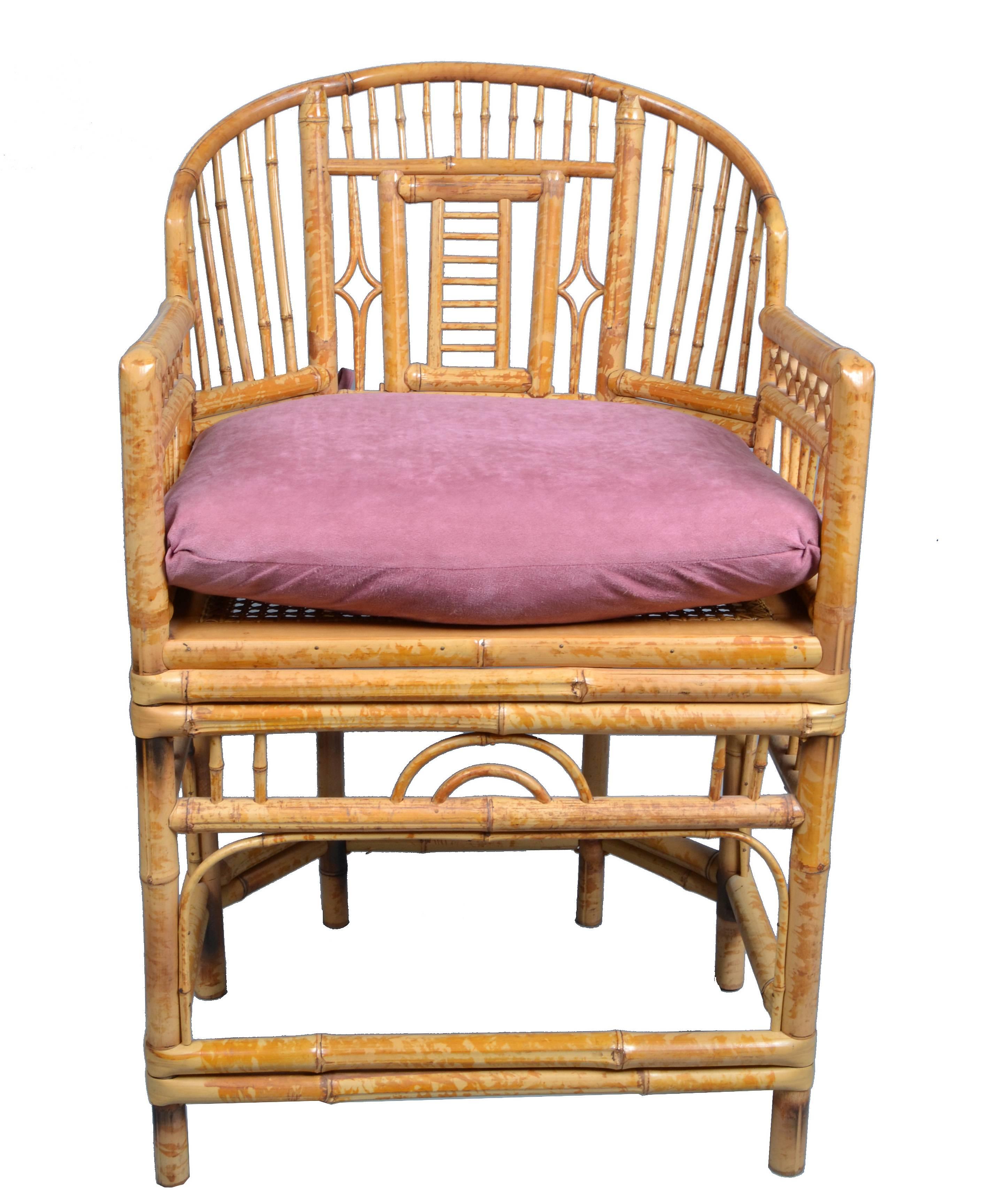Vintage pair of bamboo armchairs on six legs. These are handcrafted chairs with cane seats feature bamboo frames and Chinese inspired bamboo patterns. Each chair comes with a pink seat cushion. The backrests are designed with an extraordinary