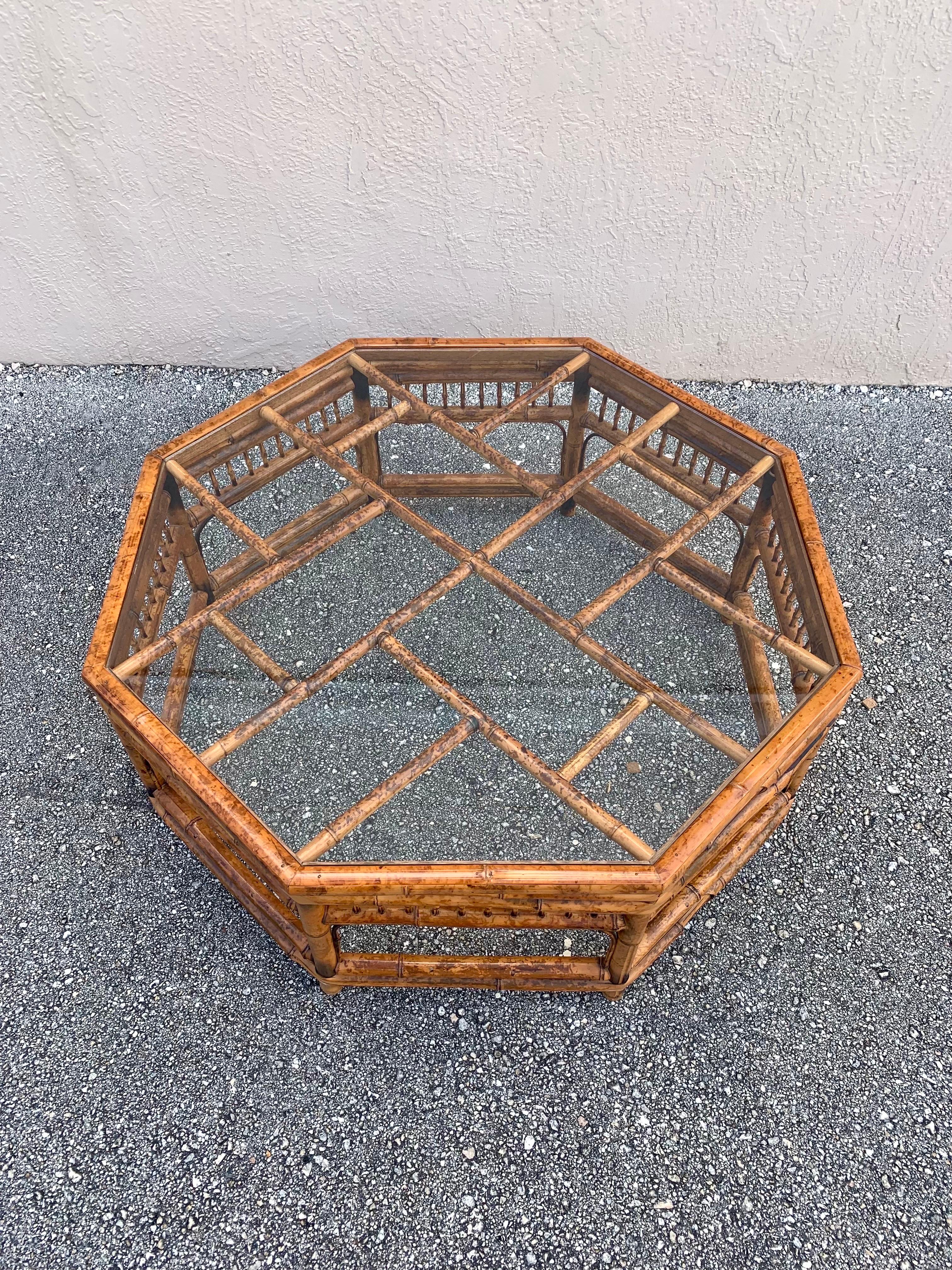 Octagonal coffee table hand made with bamboo. Expertly crafted and beautifully finished with burning techniques. 

Construction is entirely different sized bamboo and nails. 

Lots of different architectural designs including chippendale cross