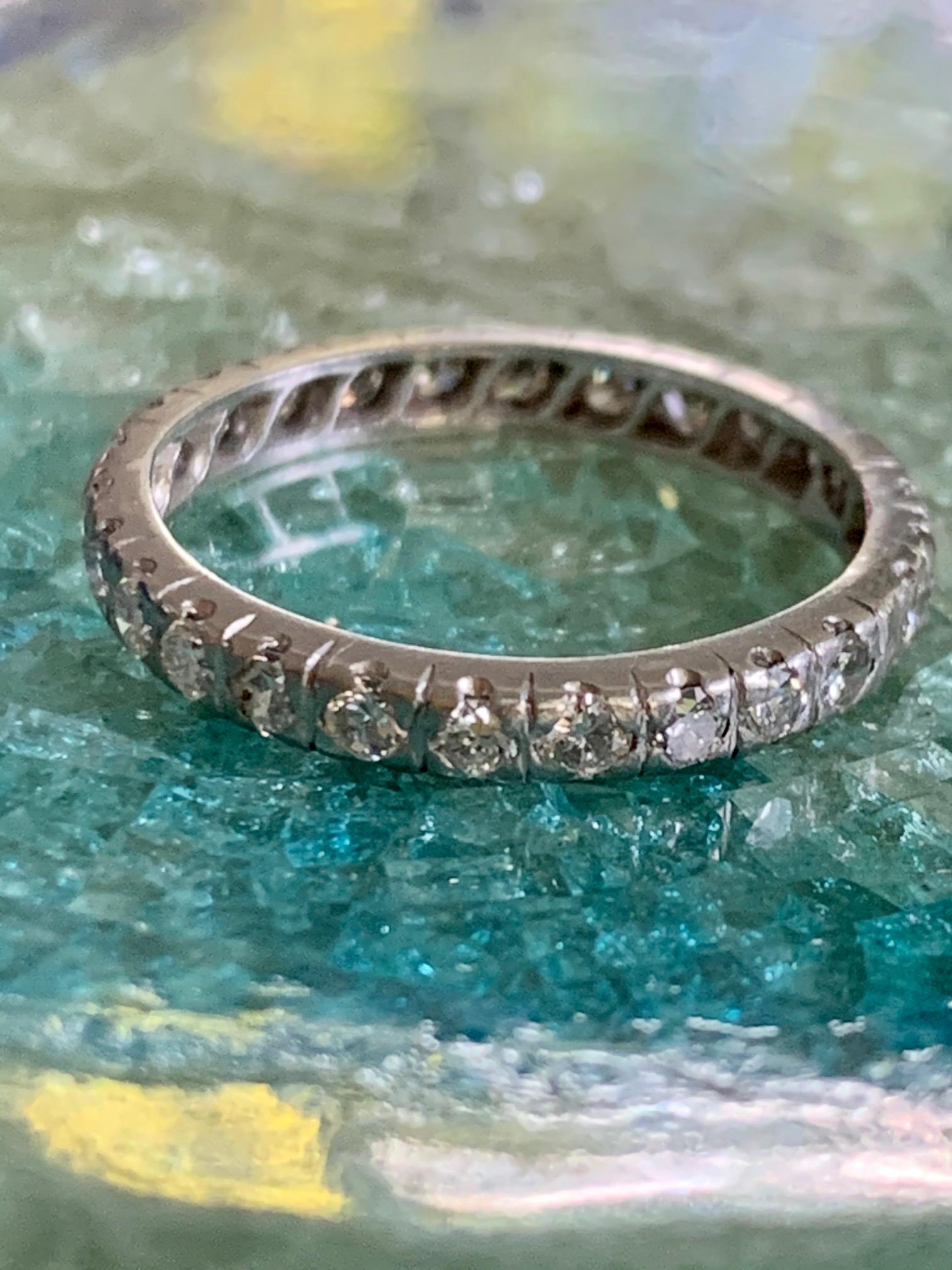 This eternity band features approximately .50ctw of brilliant cut Diamonds set in Platinum, completely encircling the entire band.  

Size:  5 3/4
Weight: 2.5 grams