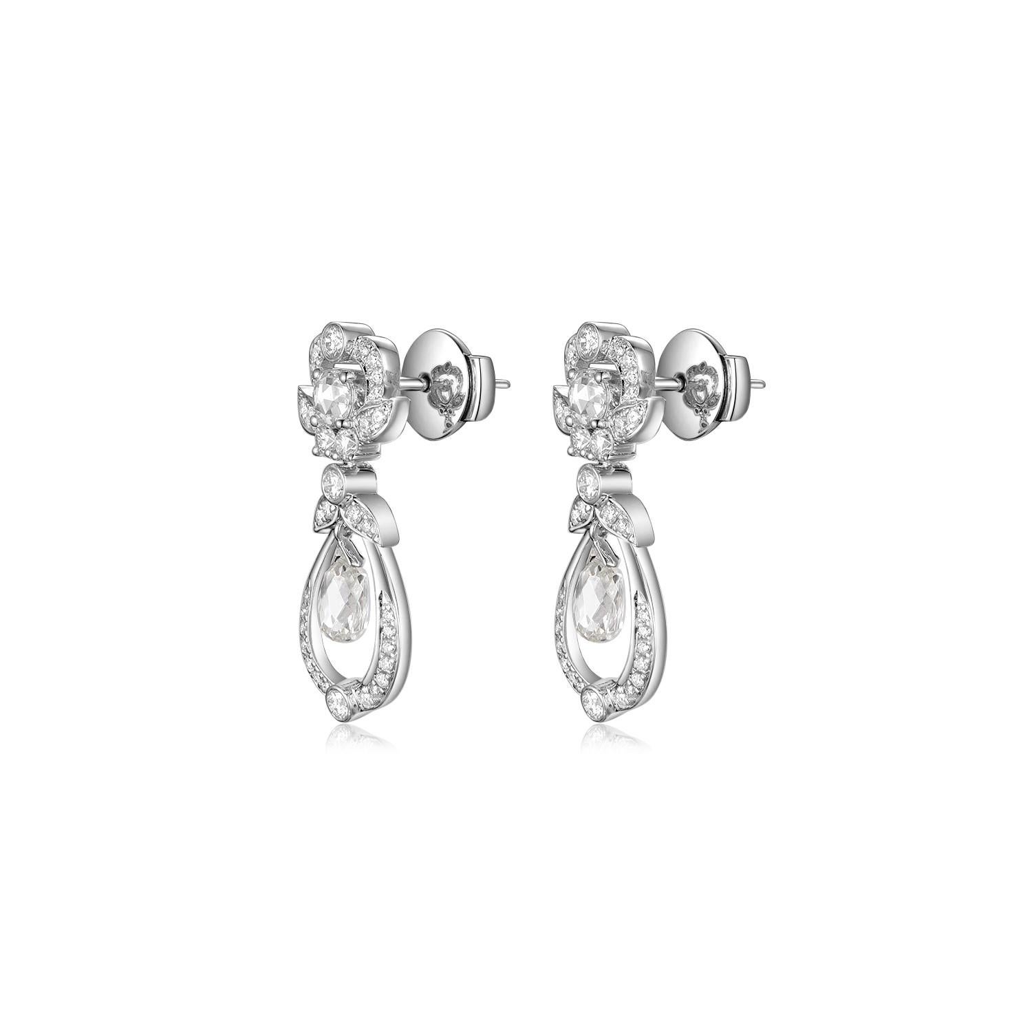 Experience the elegance of timeless design with these captivating earrings, a true testament to fine craftsmanship and luxury. The highlight of these earrings is the two rose cut diamonds weighing a total of 0.29 carat, poised gracefully on top.
