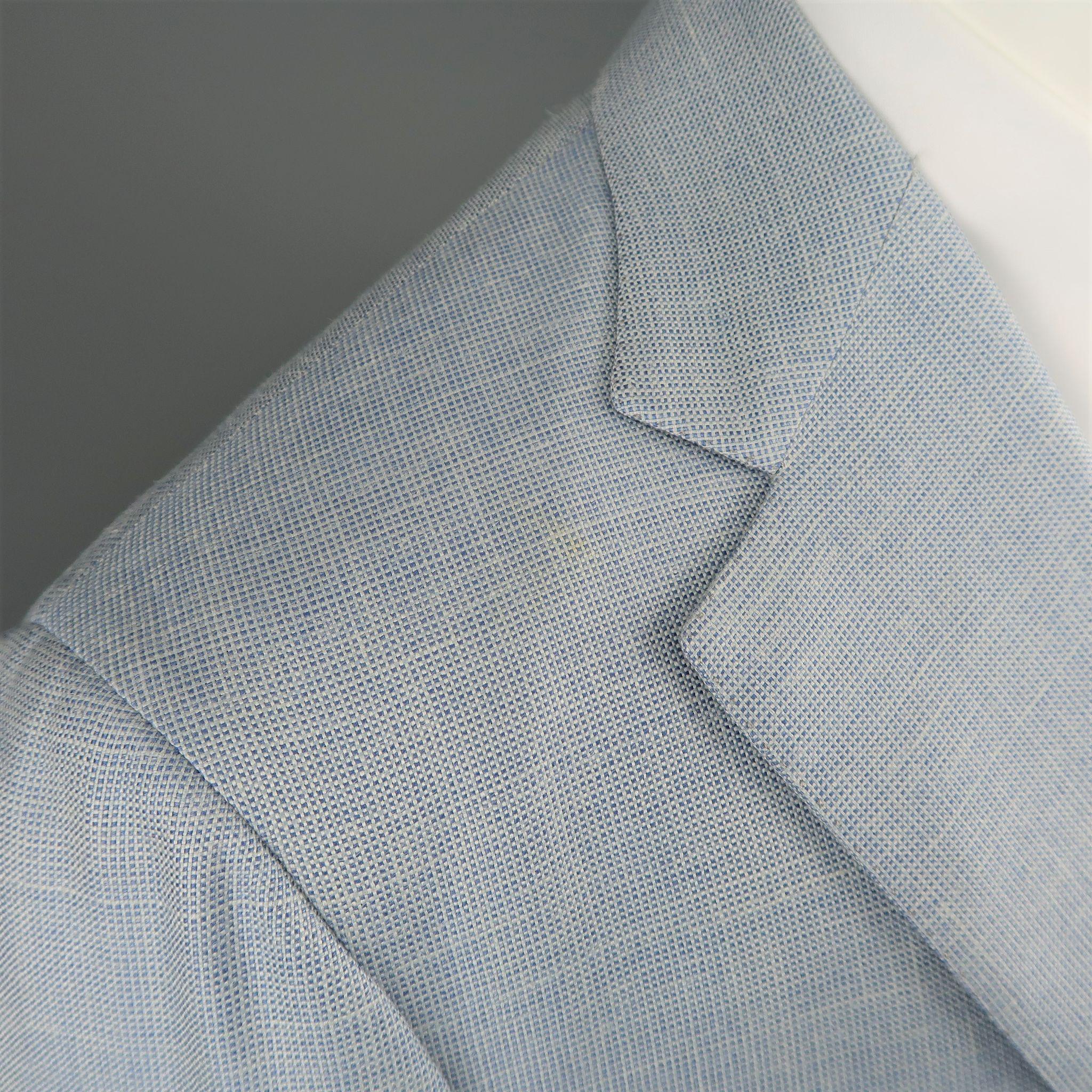Vintage BRIONI sport coat comes in light blue textured wool blend with a notch lapel, two button front, and double vented back. Stain on shoulder. As-is. Made in Italy.
 
Fair Pre-Owned Condition.
Marked: 40
 
Measurements:
 
Shoulder: 17.5