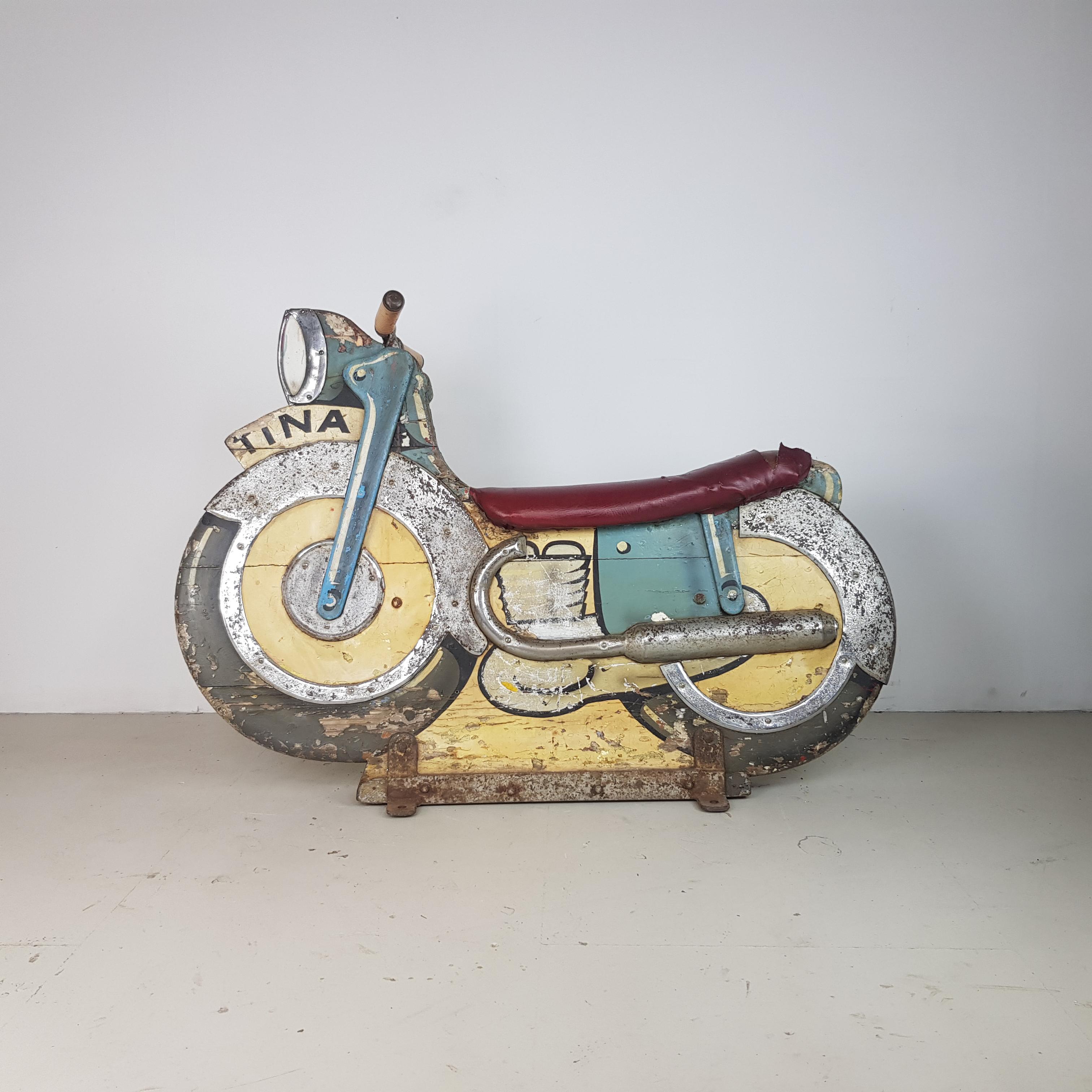 Rare and collectable 1940s fairground ride motorbike.

On a slight angle, would have been the outside ride on the carousel. 

Stands on its own or can be bolted to the floor.

Approximate dimensions:

Height 91cm

Width 130cm

Depth
