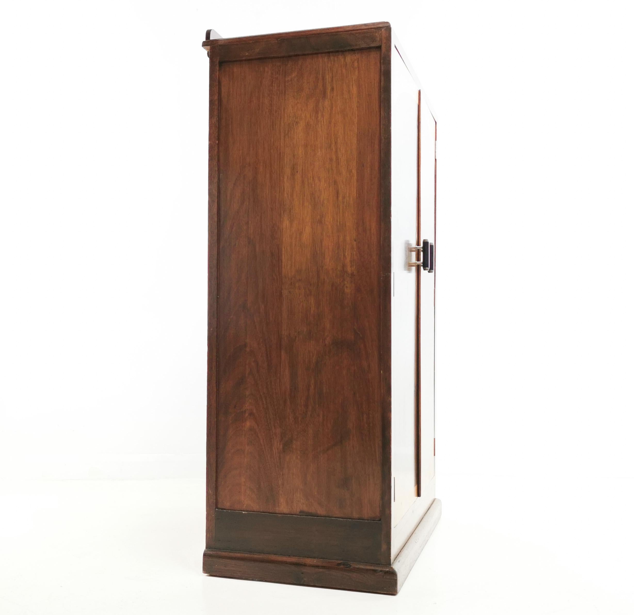 Art Deco Cupboard

1940s Art Deco cupboard in British walnut offered in very good condition with minimal signs of age and use.

Made by C.W.S Ltd, Cabinet makers of Radciffe, this versatile cupboard has a very strong art deco feel. It features a