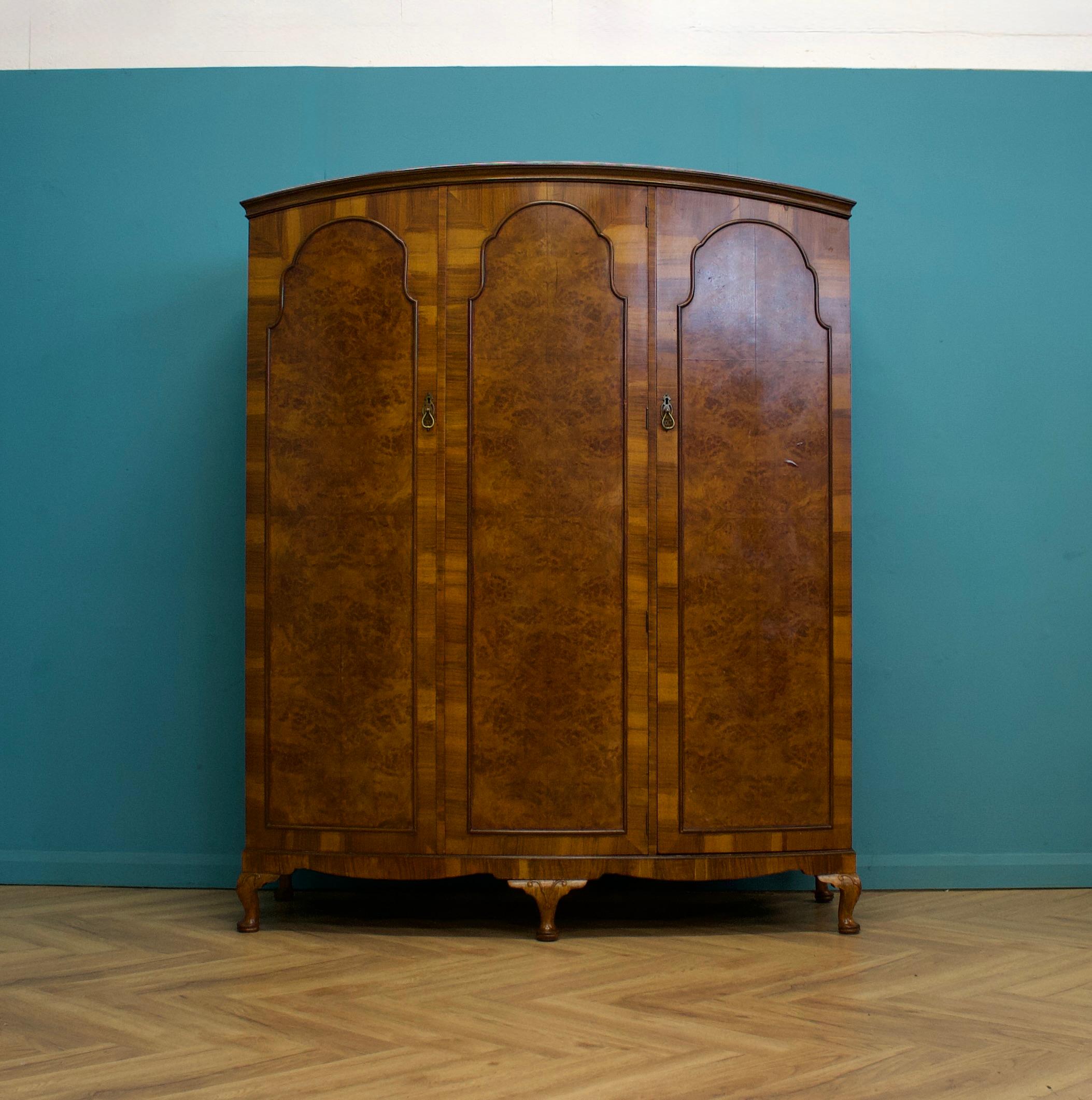 A vintage walnut triple door wardrobe, circa 1920s.


Inside, beautifully fitted out with a a clothes rail to each side.


This wardrobe dismantles into four parts.
