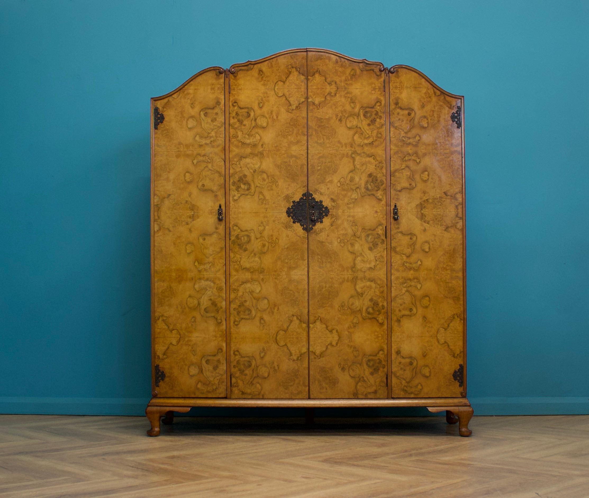 An impressive quality four door Art Deco burr walnut wardroe made by N H Chapman from the Siesta range


Made by Waring and Gillow, circa 1930s


Standing on Queen Anne style feet


Featuring two clothes rails, sheves and a drawer




The walnut