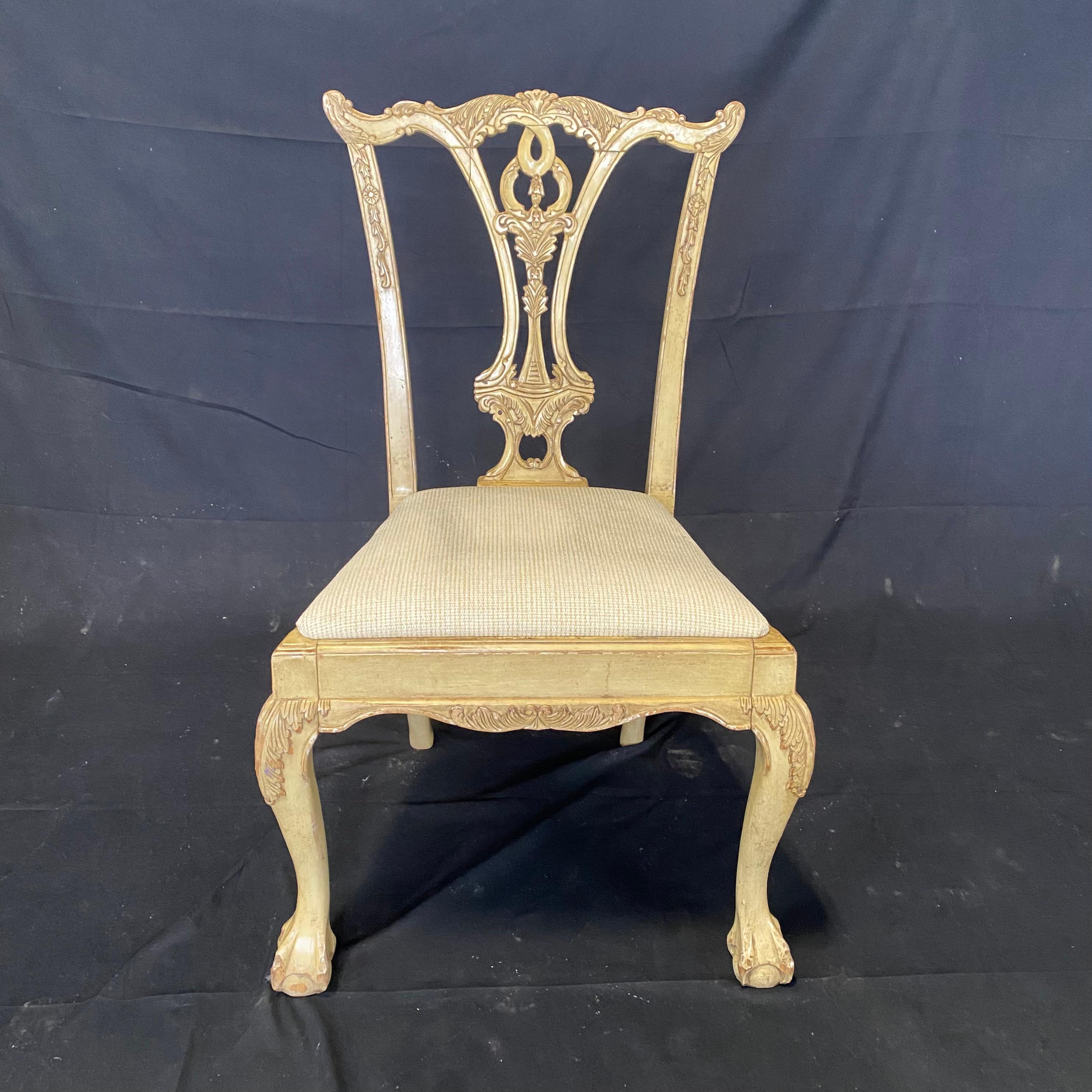 A set of six British dining side chairs in the Chippendale style, solid mahogany with carved back splat, new ivory and goldish beige textured high quality upholstered seat, cabriole legs and ball in claw feet. Two armchairs and four side chairs.