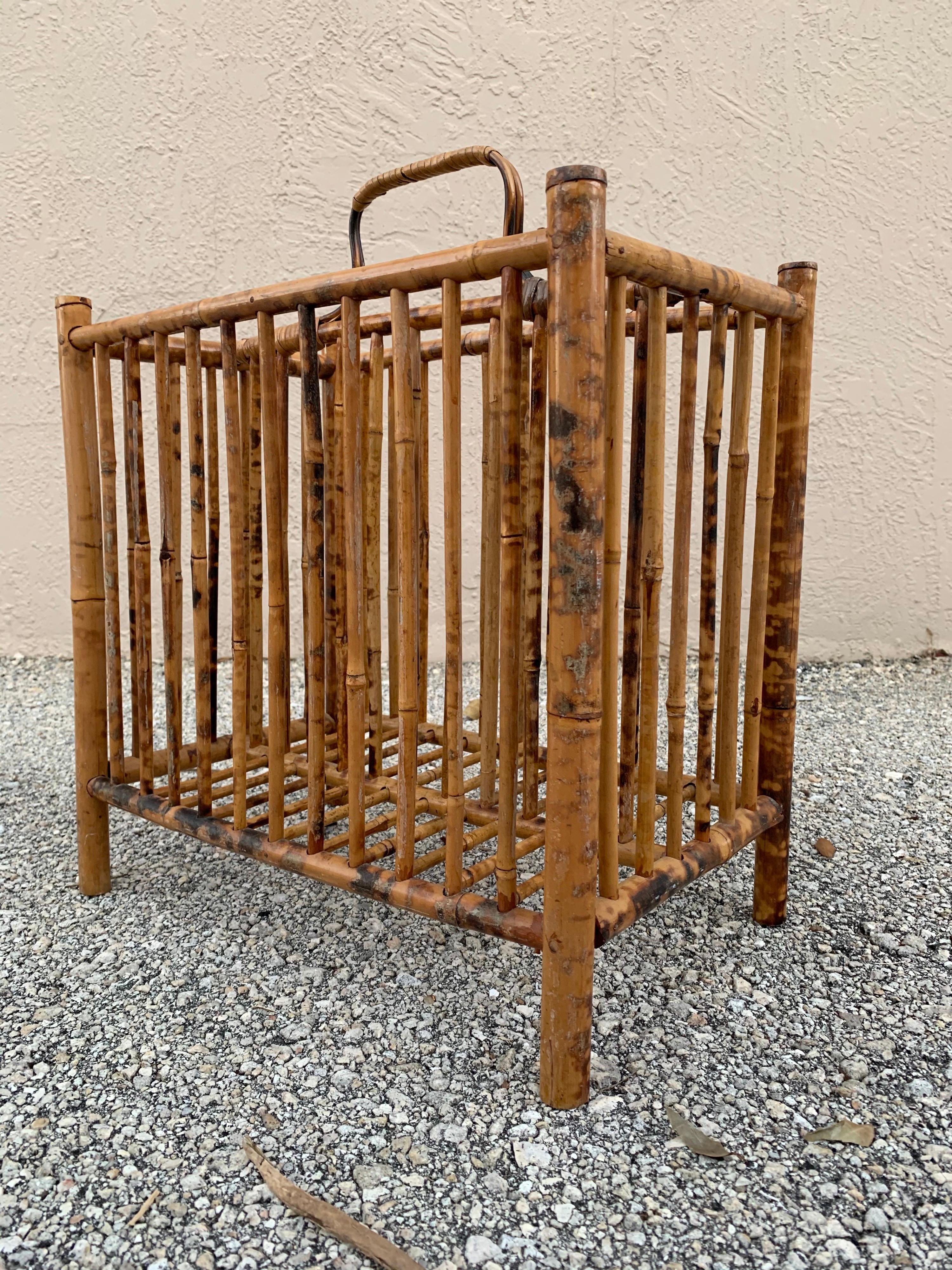 Unusual British Colonial magazine rack. Made with burnt bamboo. Simple elegant design. Well made and kept.