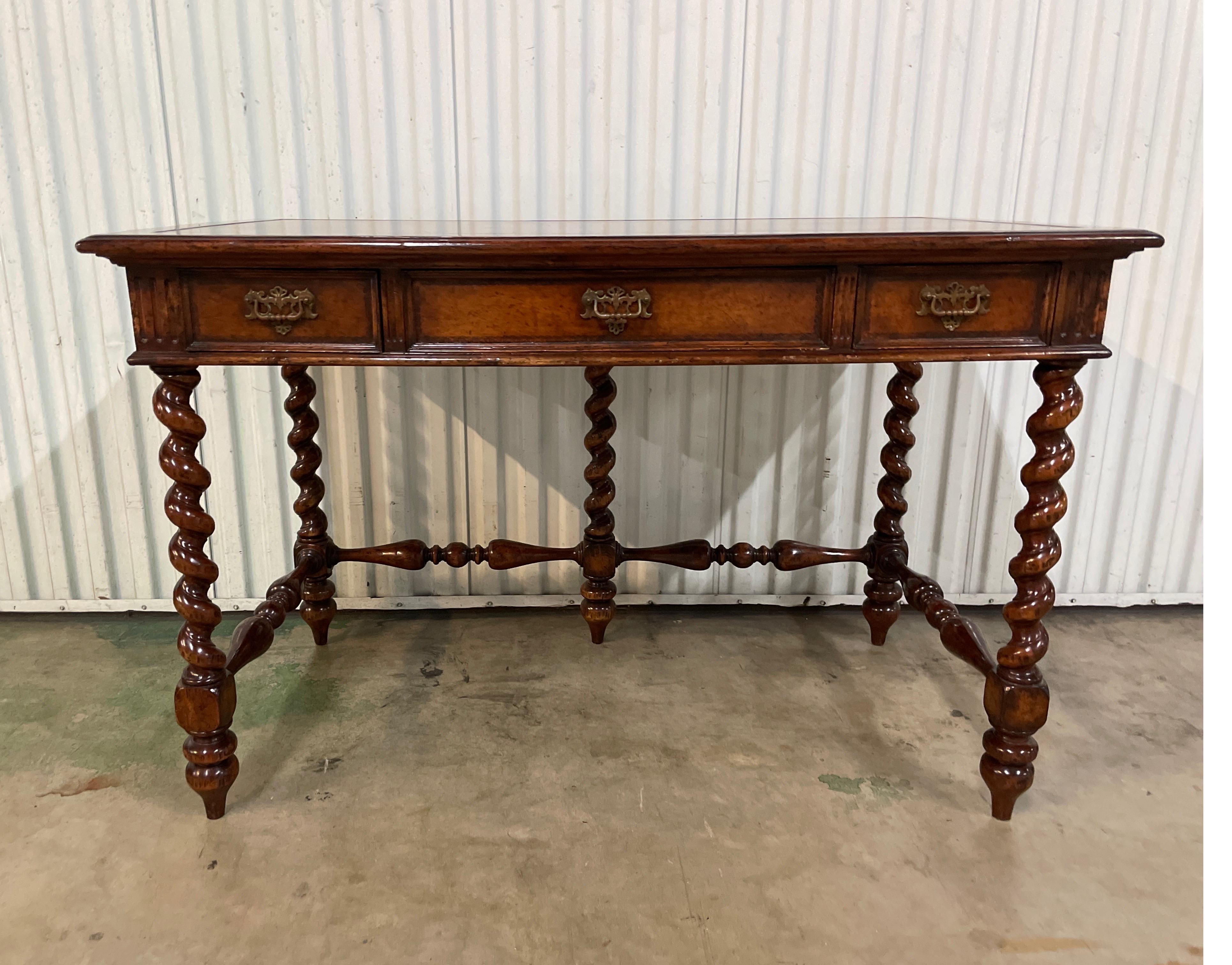 Handsome British Colonial barley twist leg desk with three drawers & leather top.
