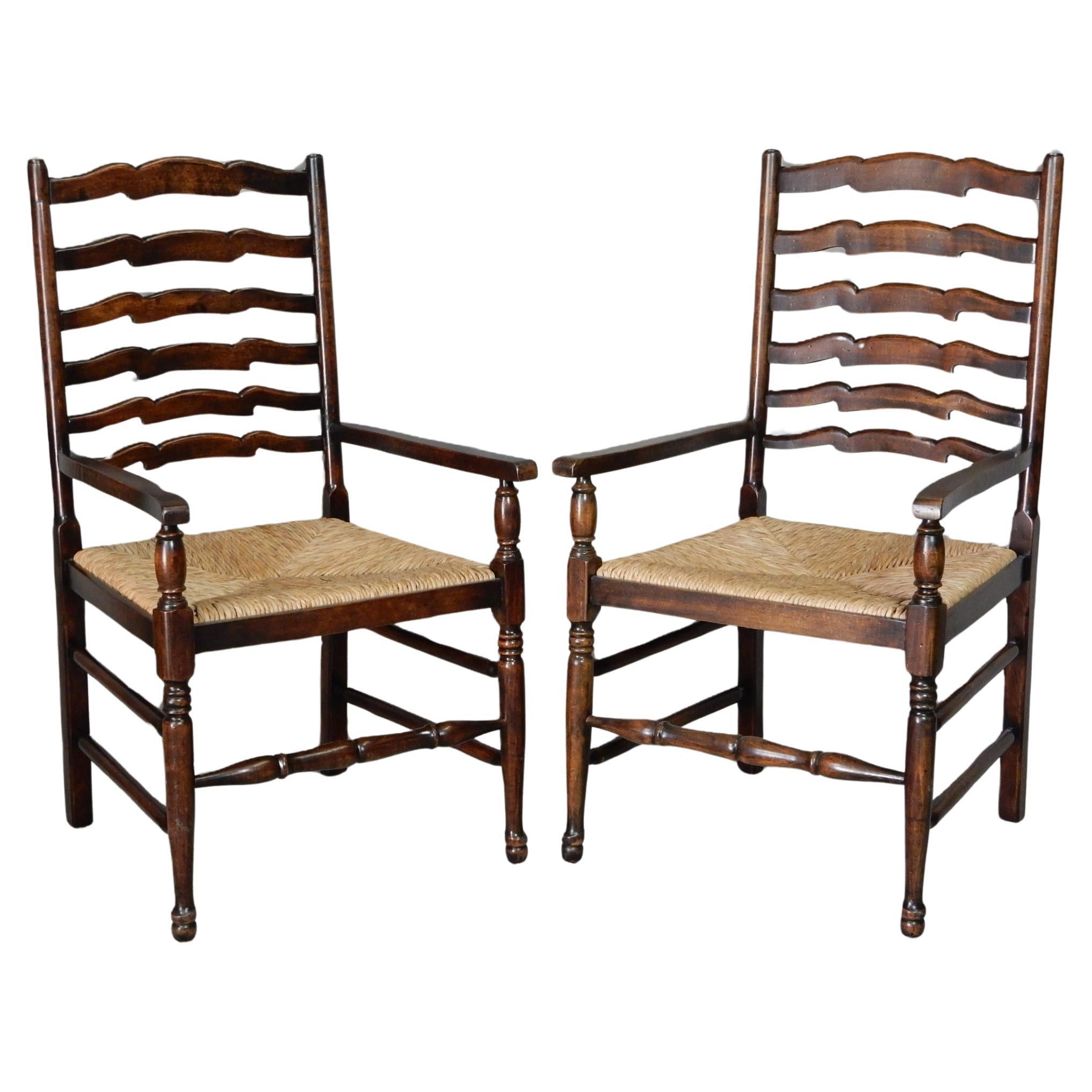 Beautiful pair of British Colonial plantation armchairs with tall ladder back and natural woven Rush seating, Circa 1960's. Oak or Mohogany.
Exceptional quality crafted chairs with no issues or damage.