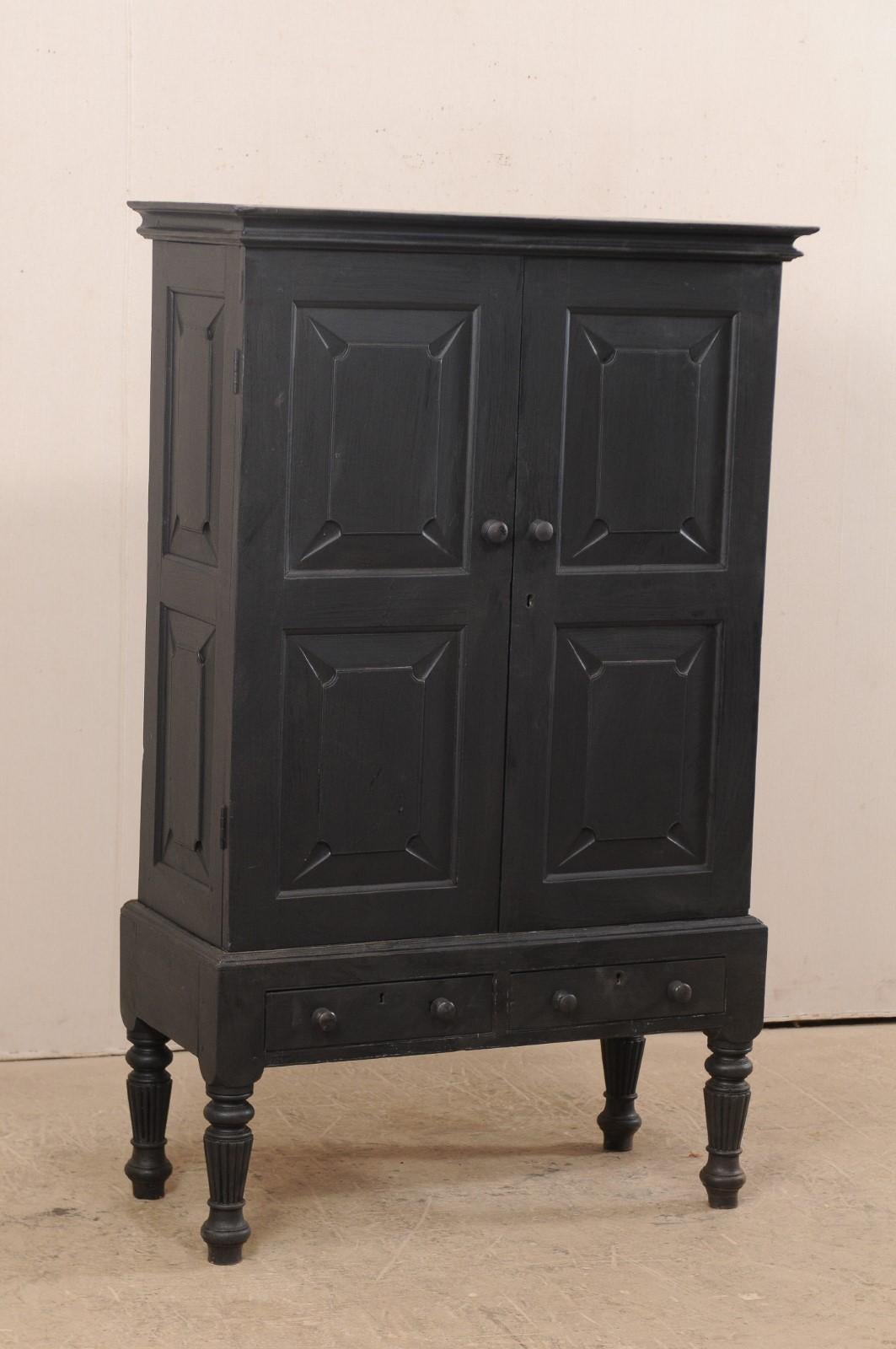 Carved Vintage British Colonial Raised Black Colored Cabinet, Mid-20th Century