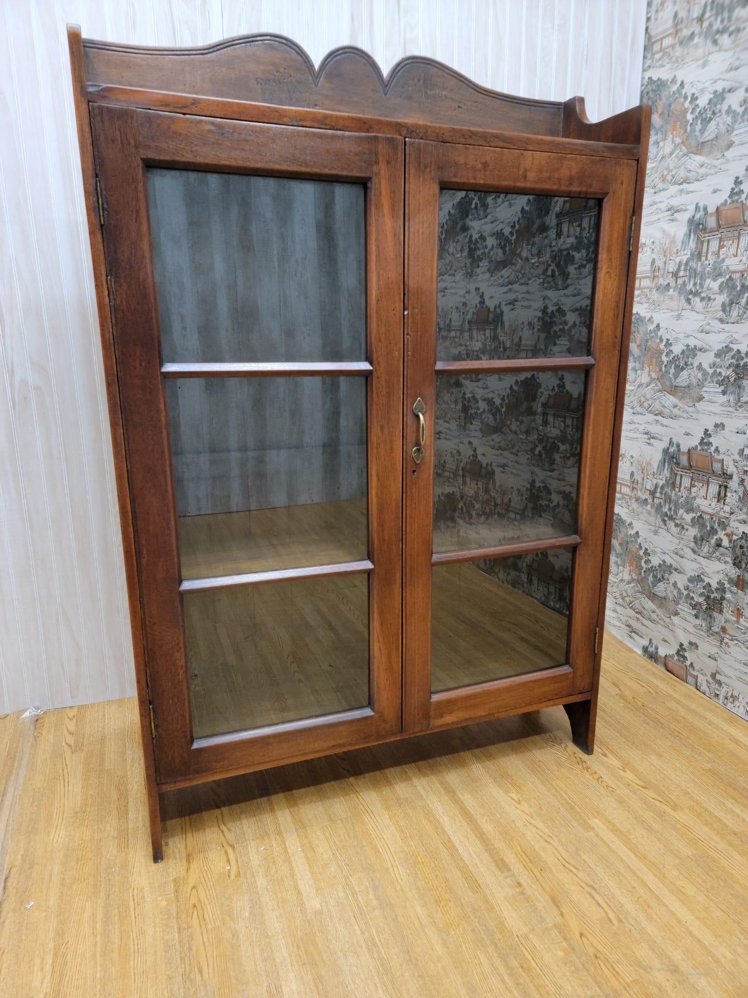 vintage display cabinet with glass doors